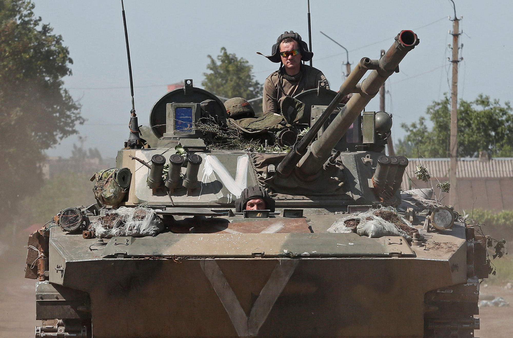Pro-Russian troops ride an infantry fighting vehicle in the town of Popasna in the Luhansk Region, Ukraine, on June 2.