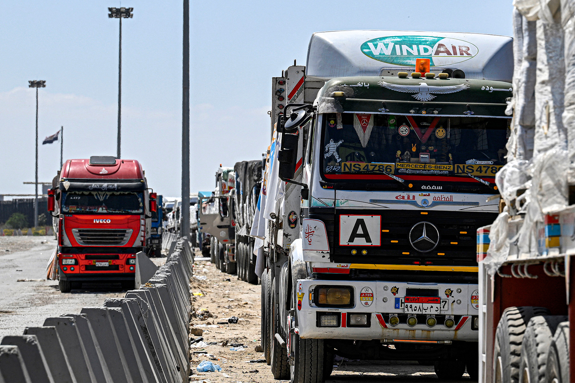Egyptian trucks carrying humanitarian aid bound for the Gaza Strip are lined up outside the Rafah border on March 23. 