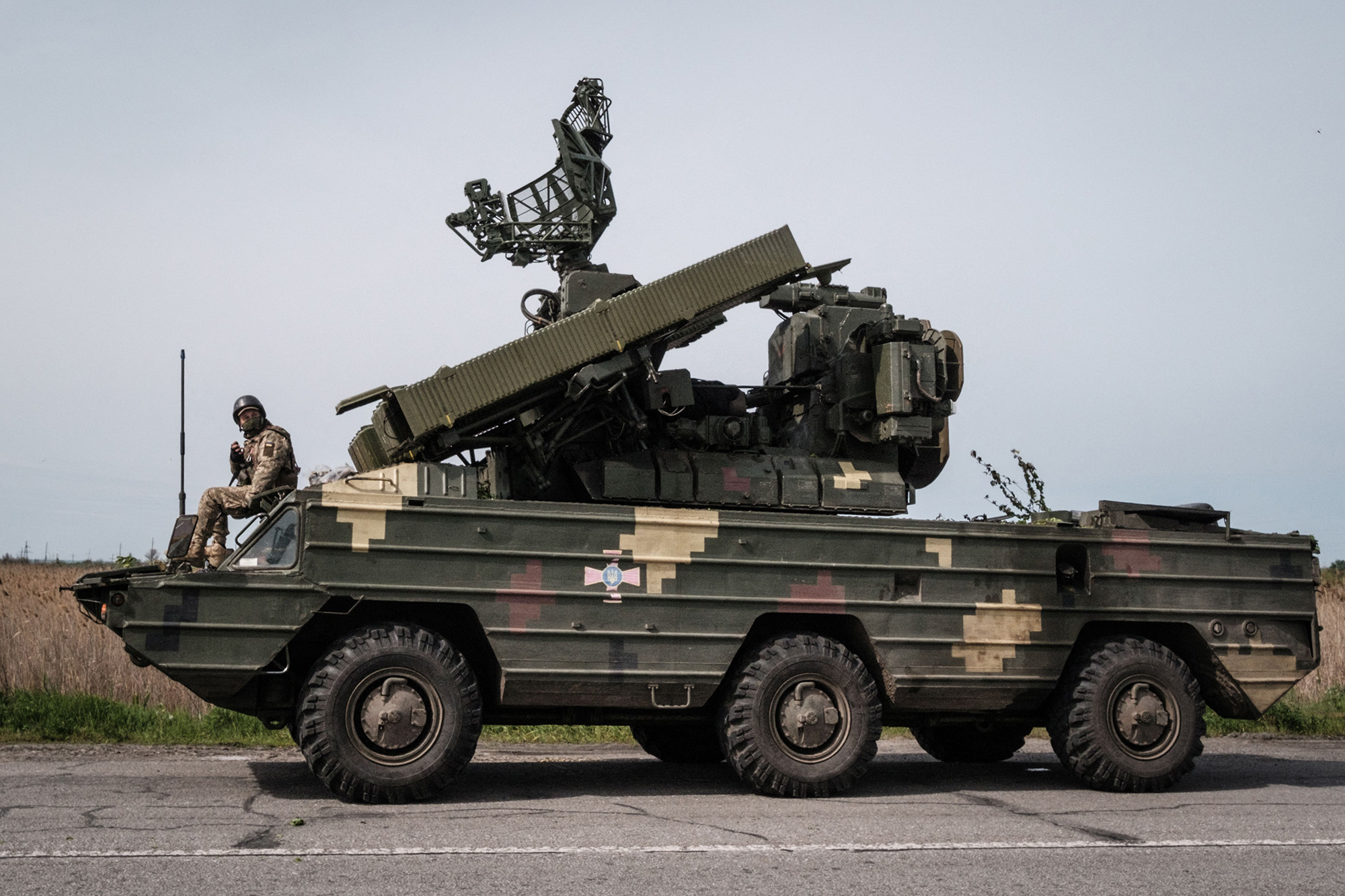 A Ukrainian soldier sits on an anti-aircraft missile system near Sloviansk, eastern Ukraine, on May 11.