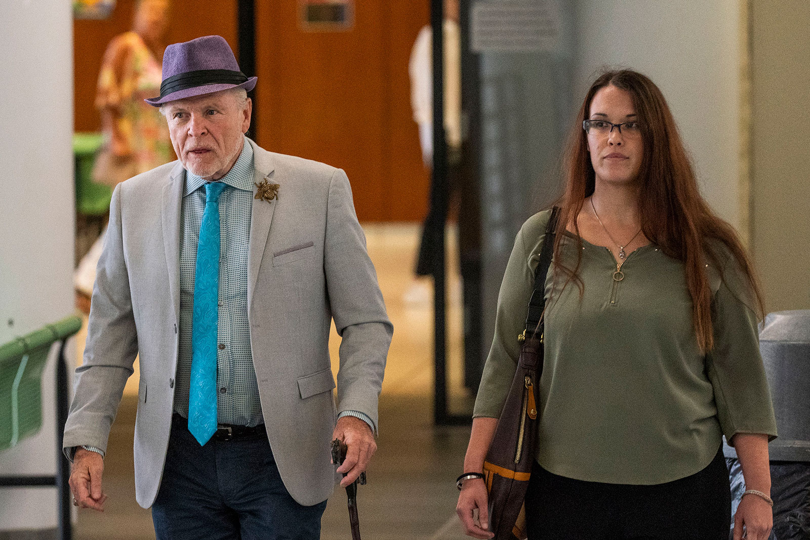 Attorney John Ray left, and Jasmine Robinson, a family representative for Jessica Taylor, walk inside the Arthur M. Cromarty Court Complex in Riverhead, New York, on Friday.