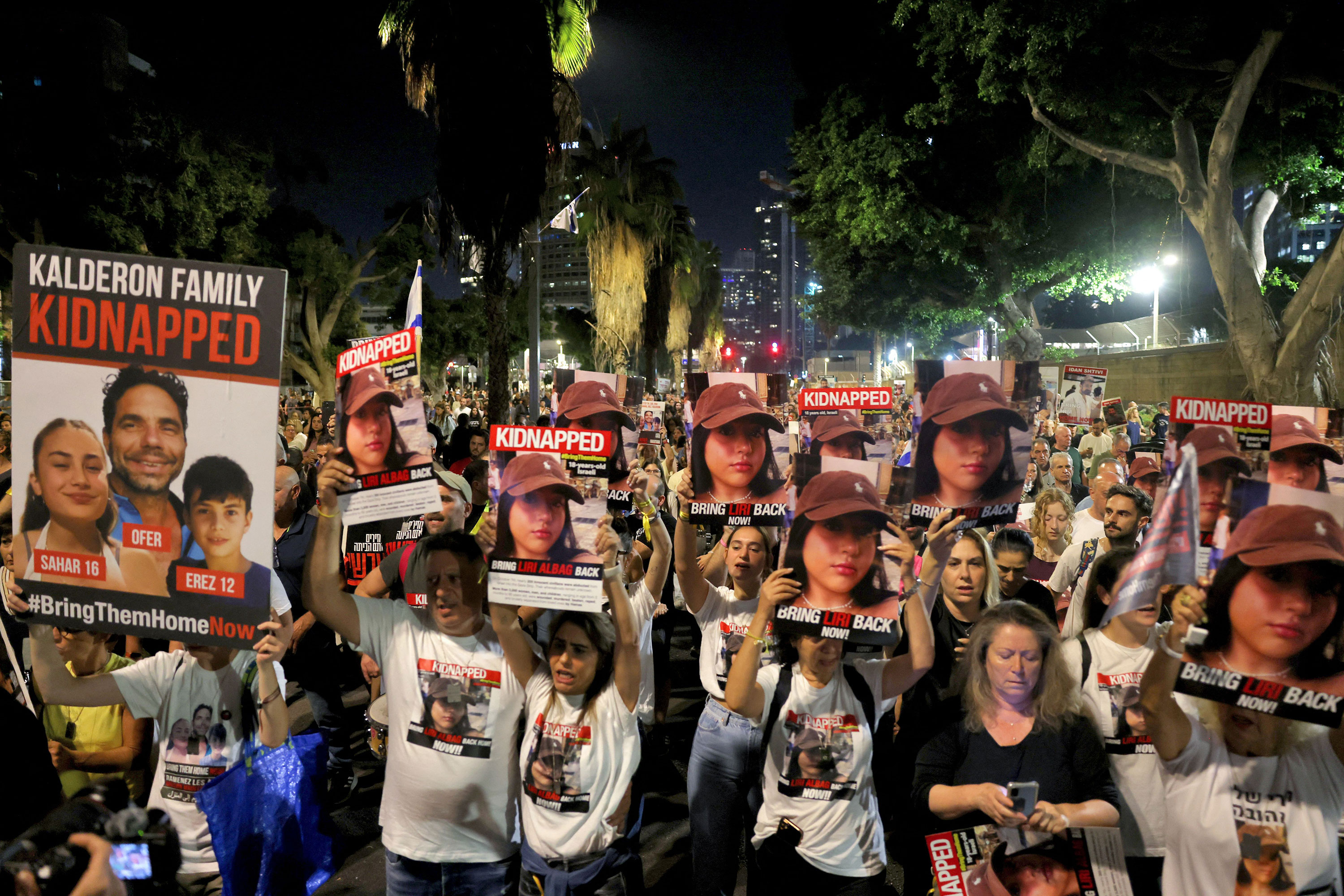 People carry posters during a demonstration calling for the release of Israeli hostages in Tel Aviv, Israel, on November 11. 