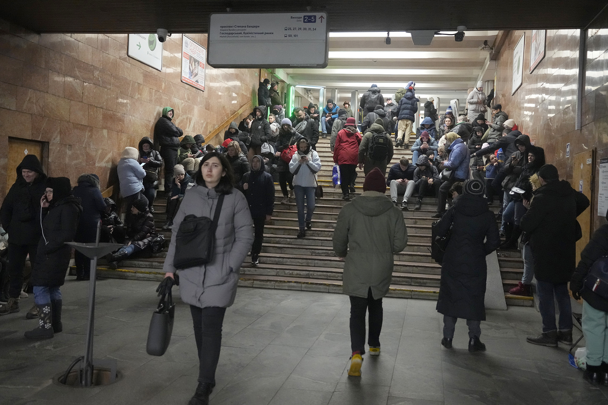 People gather in a subway station being used as a bomb shelter during a rocket attack in Kyiv, Ukraine, on January 26.