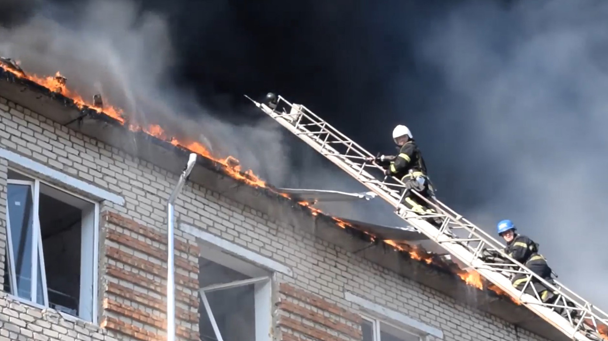Firefighters battle a blaze following a missile strike on a building in Mykolaiv, Ukraine on July 5.