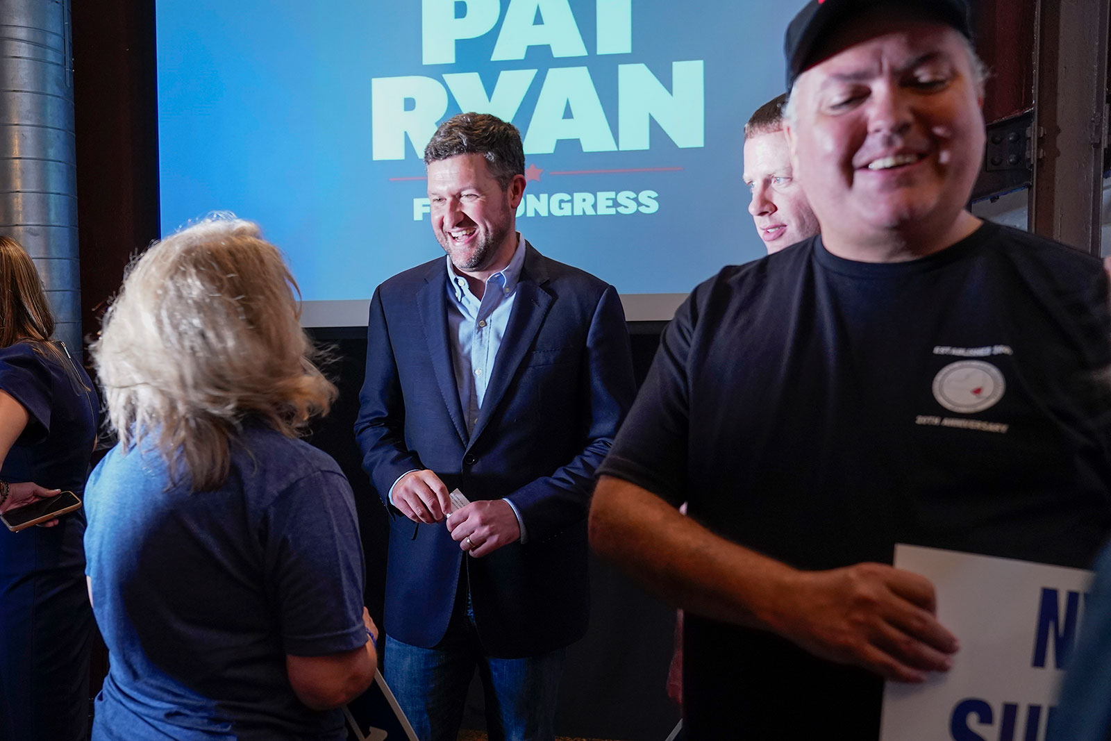 Pat Ryan, center, speaks to supporters during a campaign rally in Kingston, New York, on Monday. 