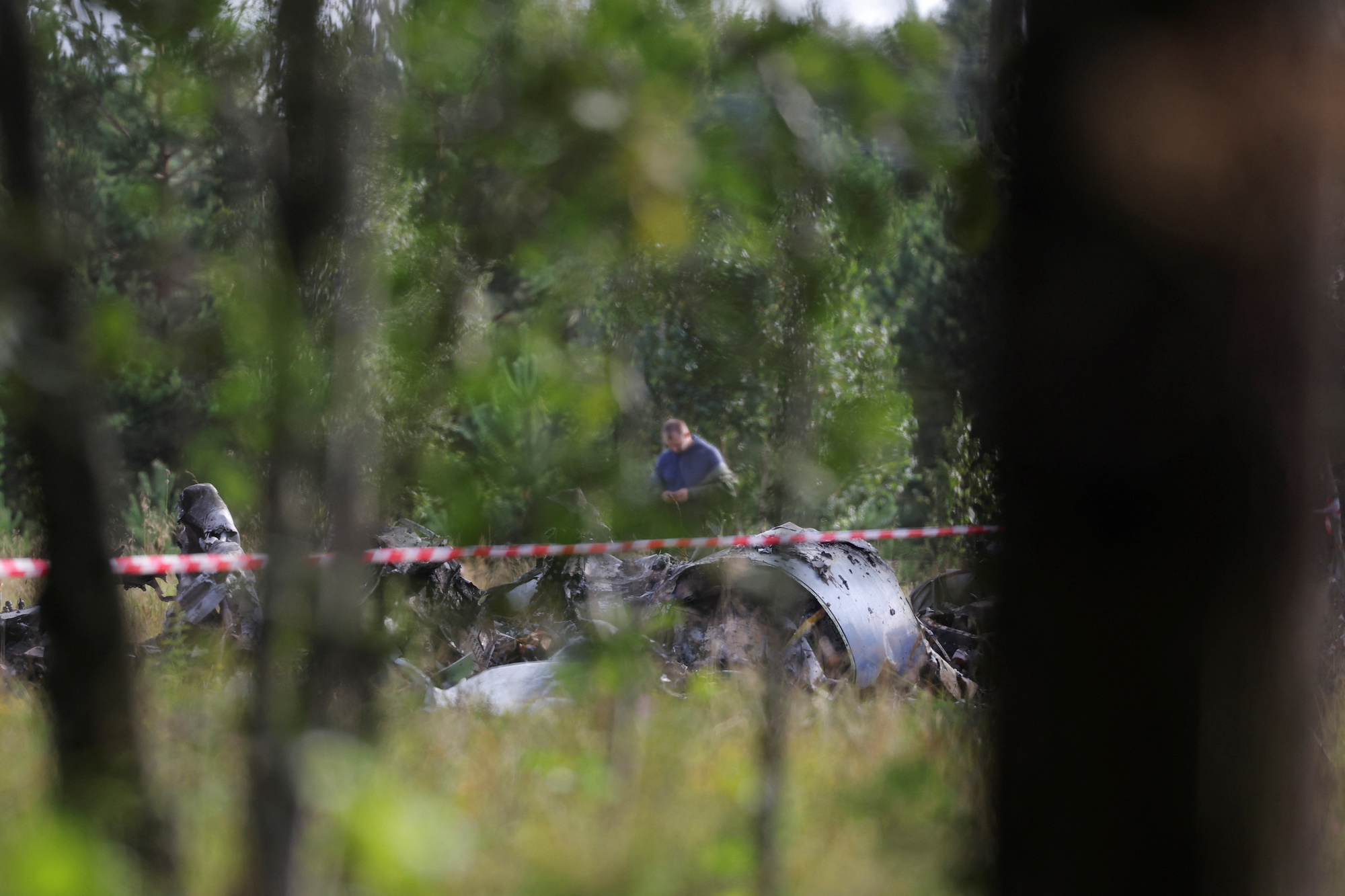 A specialist works at the site of a crash of the private jet linked to Yevgeny Prigozhin in the Tver region, Russia, on August 24.