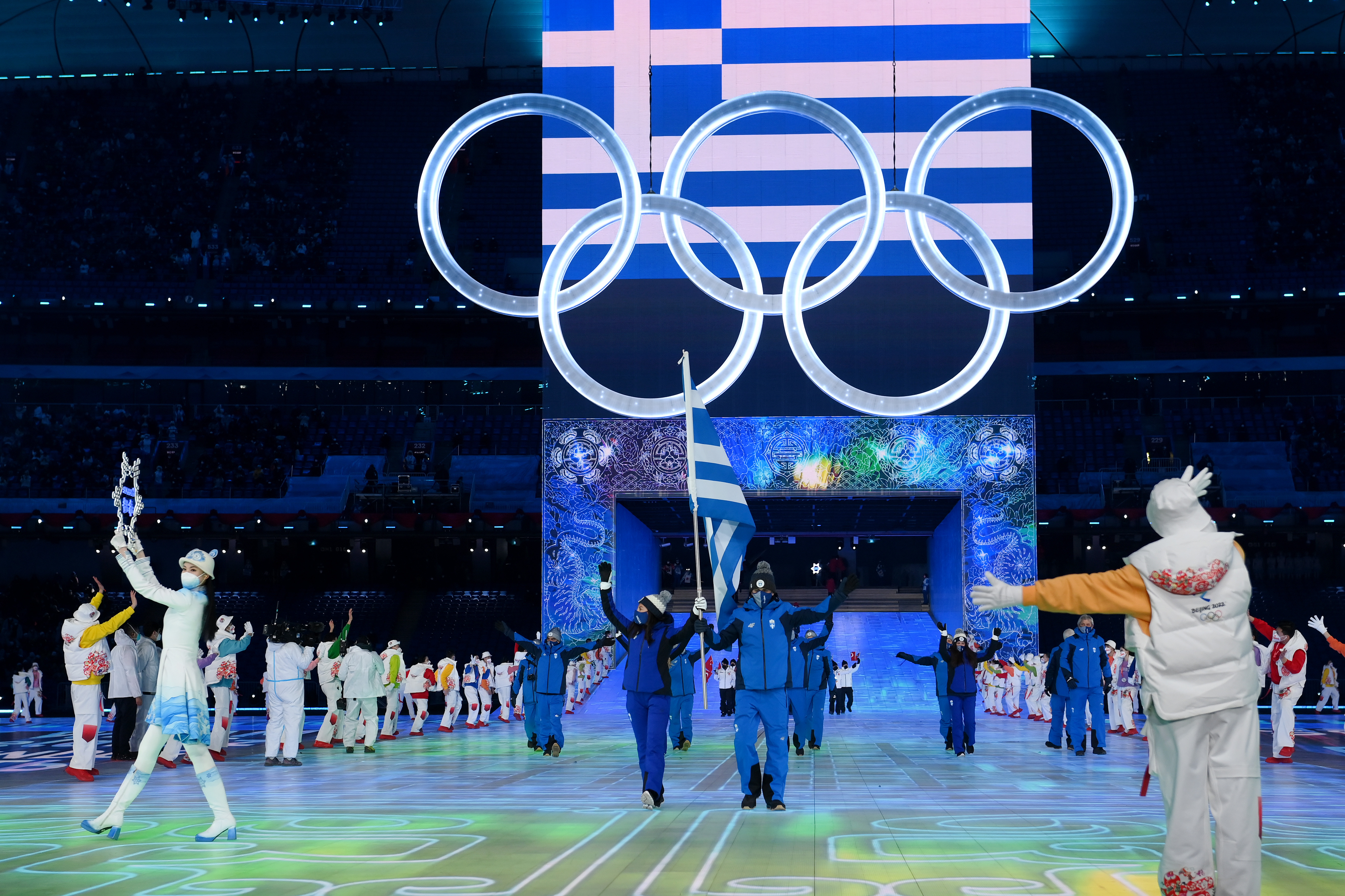 Flag bearers Apostolos Angelis and Maria Ntanou of Team Greece carry their flag during the Opening Ceremony of the Beijing 2022 Winter Olympics at the Beijing National Stadium on February 04 in Beijing, China