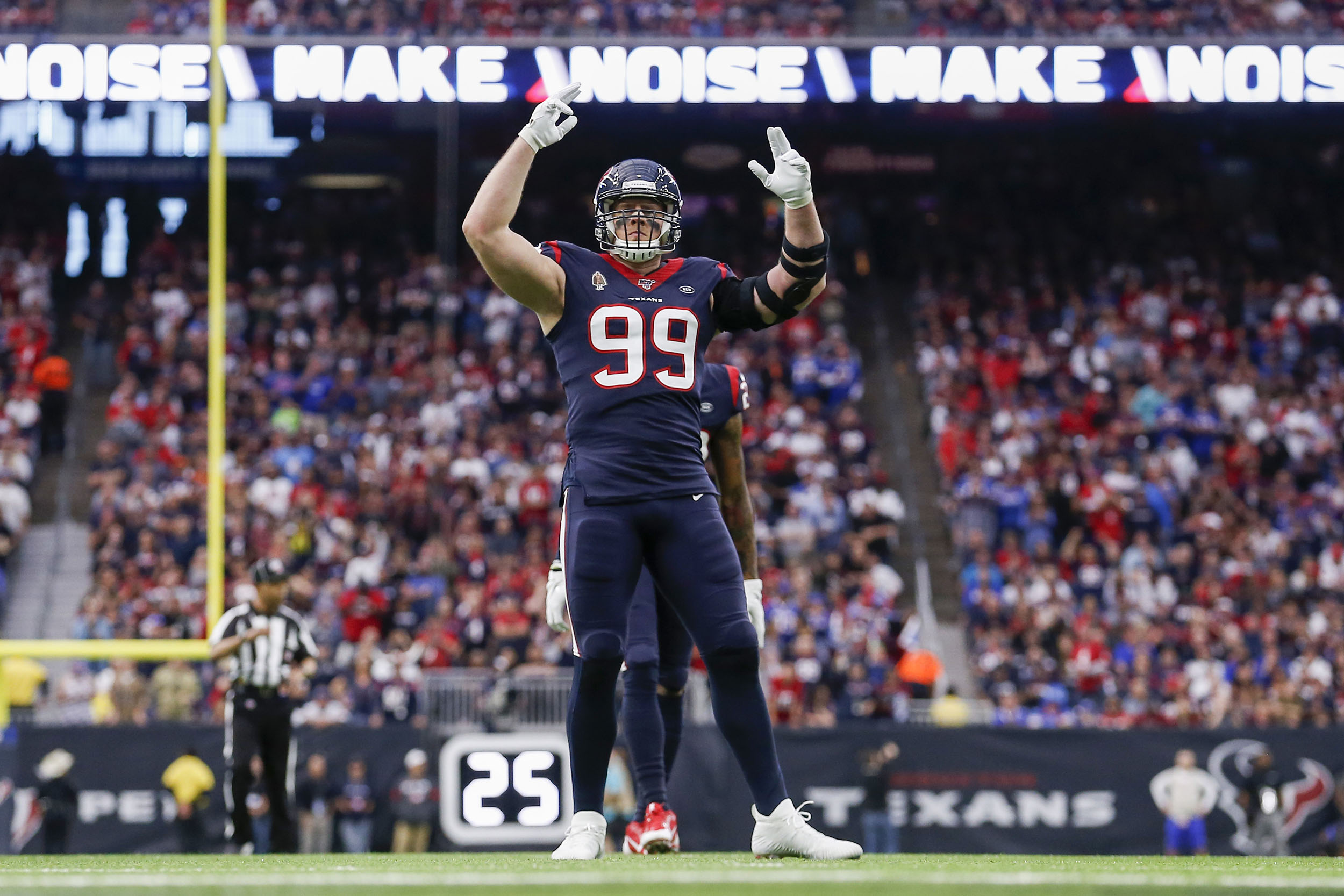 J.J. Watt of the Houston Texans pumps up the fans against the Buffalo Bills in a AFC Wild Card Playoff game at NRG Stadium on January 4, in Houston, Texas. 
