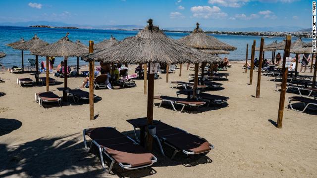 People enjoy a day at Kavouri Beach in Vouliagmeni, Greece, on May 23, 2020.