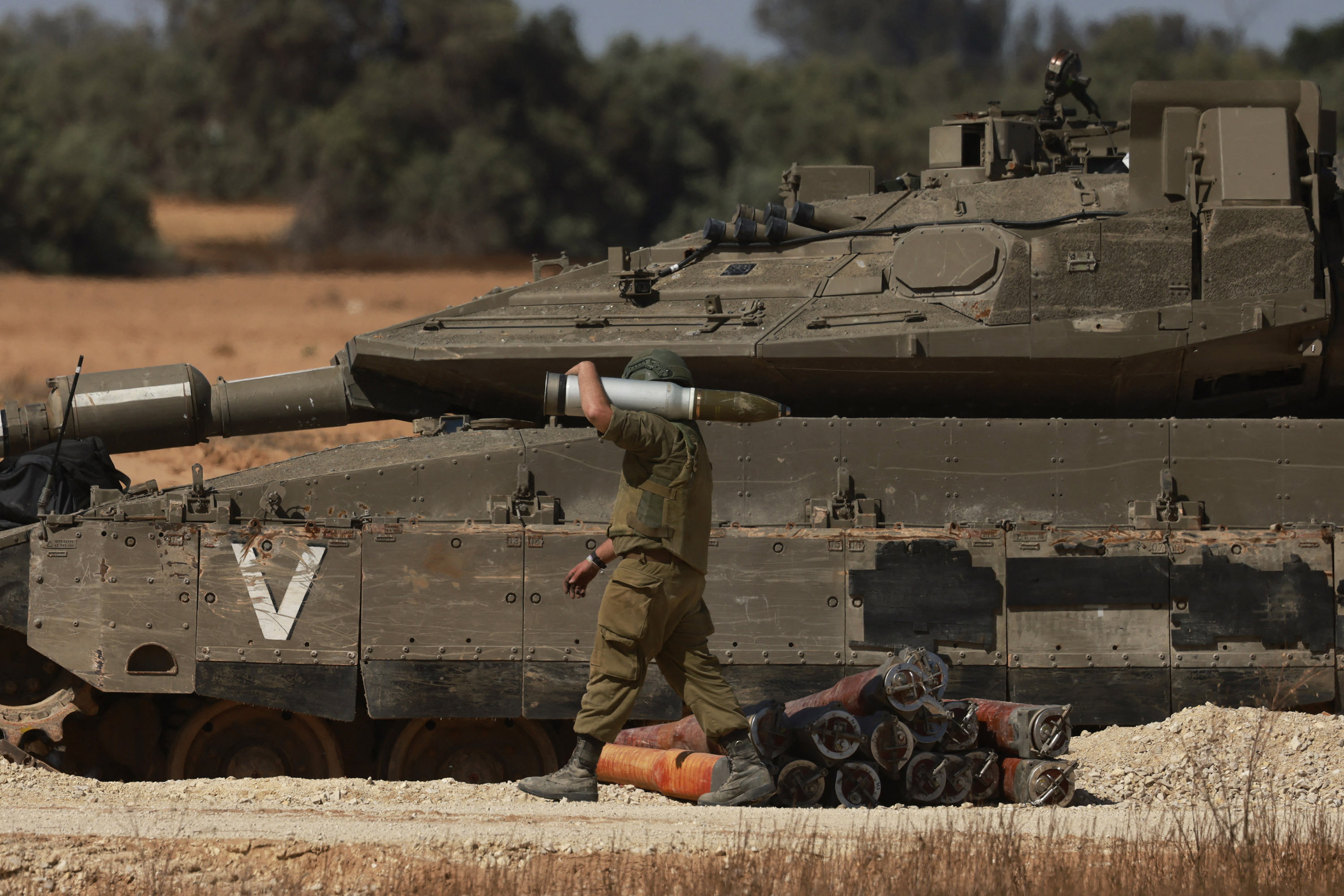 Israeli army tanks take position in southern Israel near the border with the Gaza on May 6. Menahem 