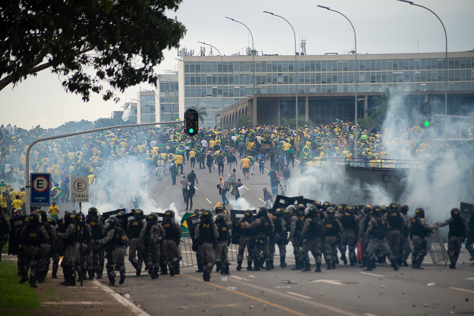 Supporters of former Brazilian President Bolsonaro clash with law enforcement officers on Sunday. 