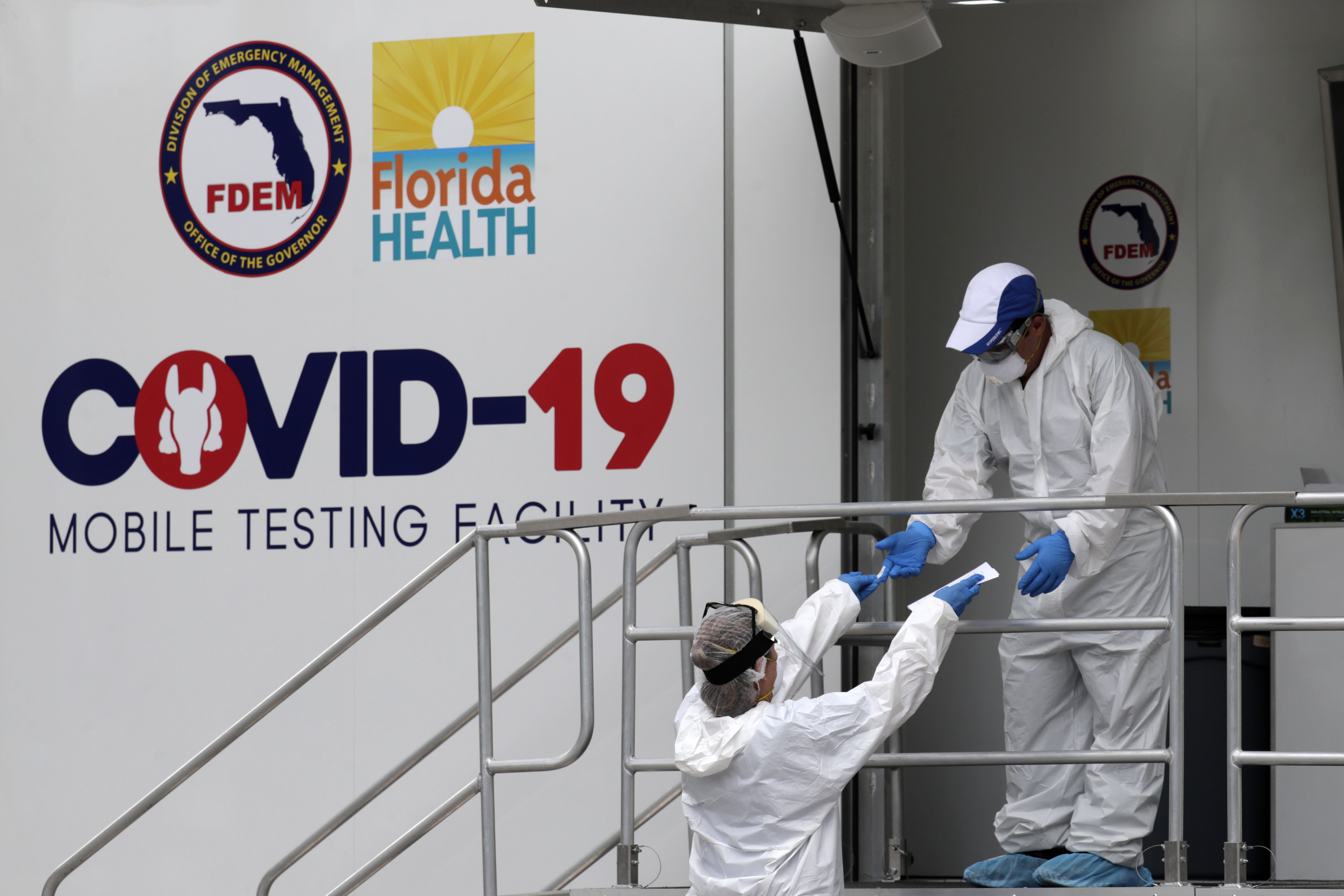 Health care personnel work at a walk-up Covid-19 testing site in Miami Beach, Florida, on July 17.