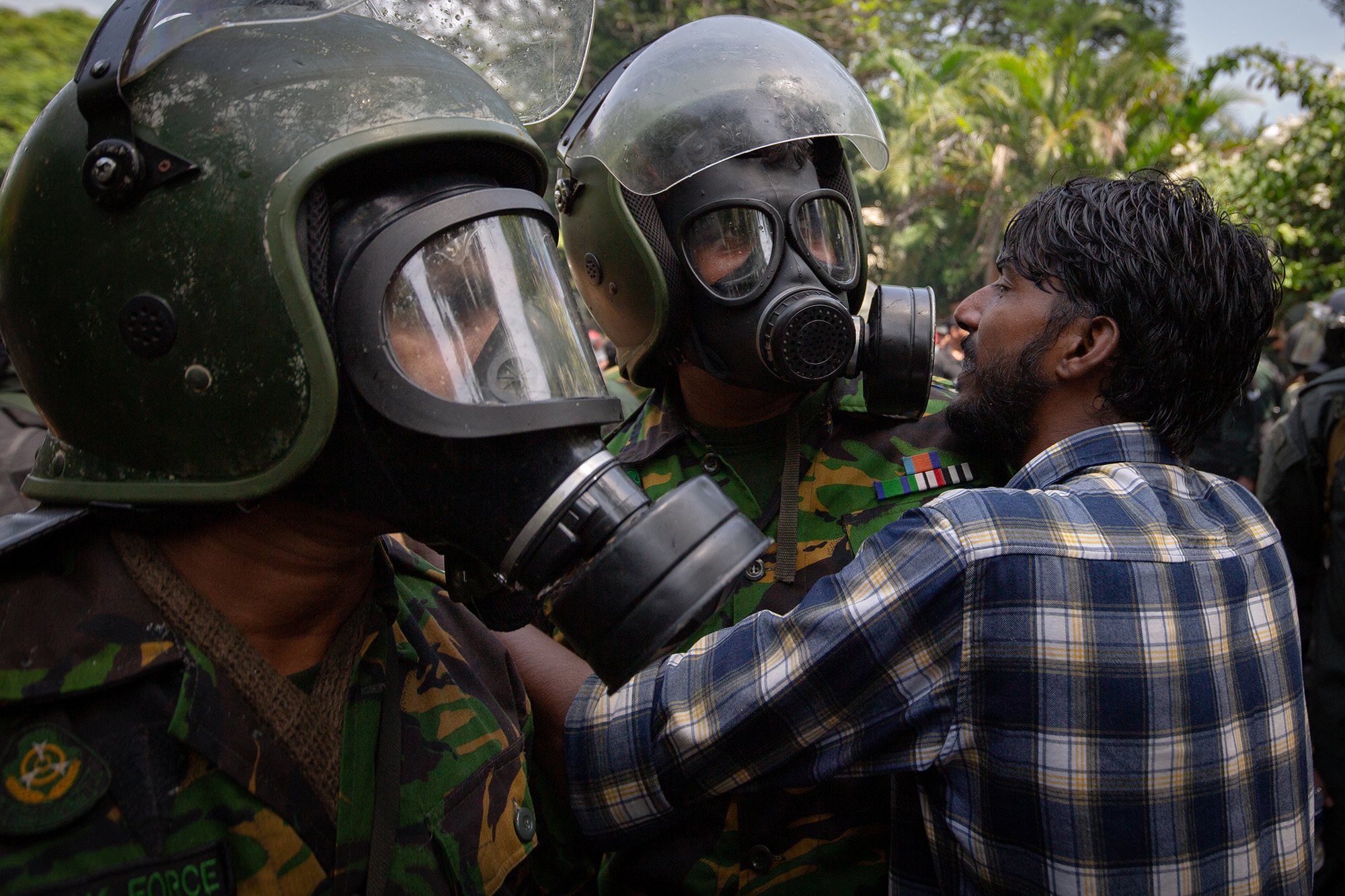 A protester confronts soldiers during a protest outside the office of Sri Lanka's Prime Minister Ranil Wickremesinghe on July 13, in Colombo, Sri Lanka. 