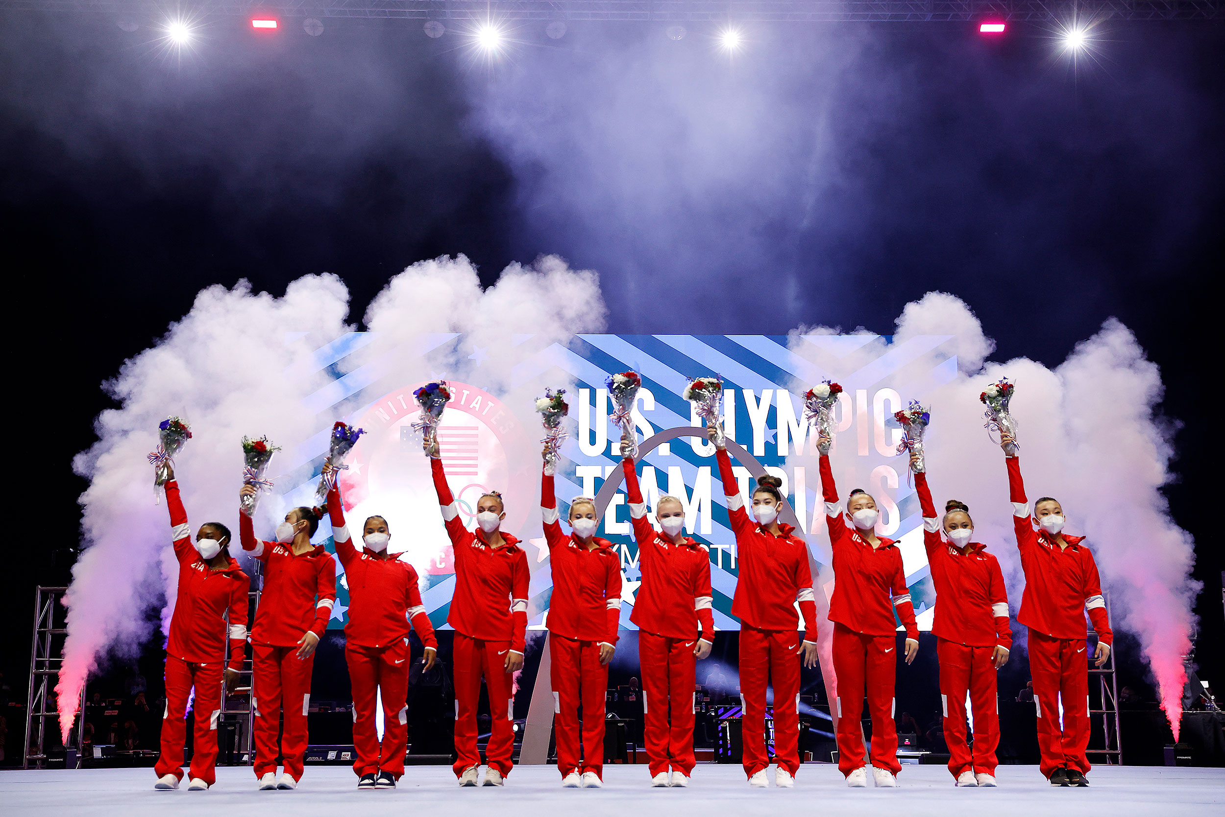 Members of the US women's gymnastics team pose for a photo following Olympic trials in St. Louis, Missouri, on June 27.