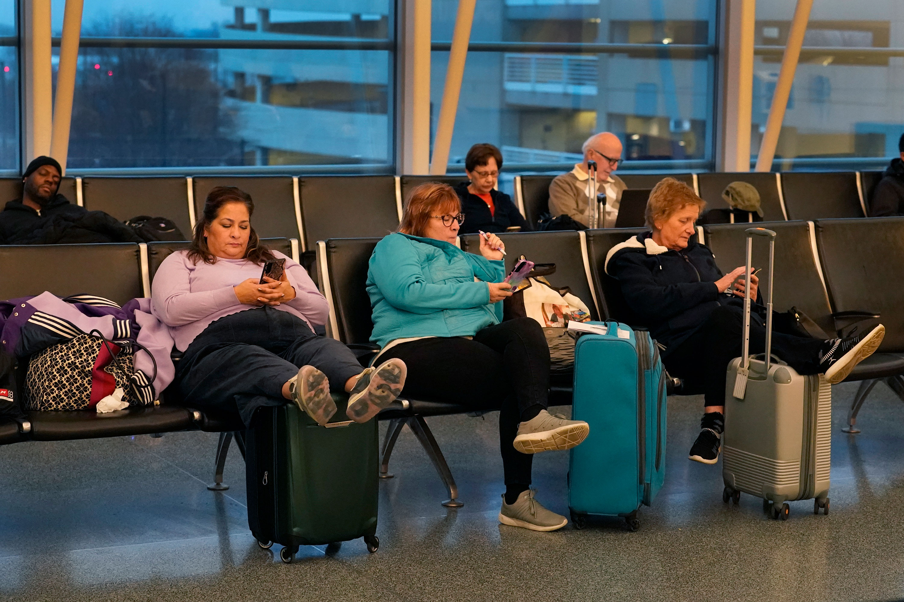 Passengers wait at Chicago's Midway Airport on Wednesday.