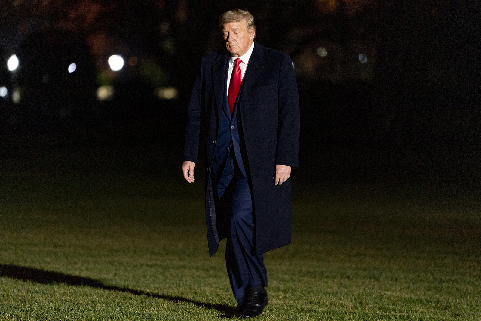 President Donald Trump arrives in the early morning hours on Tuesday, January 5 at the White House in Washington.