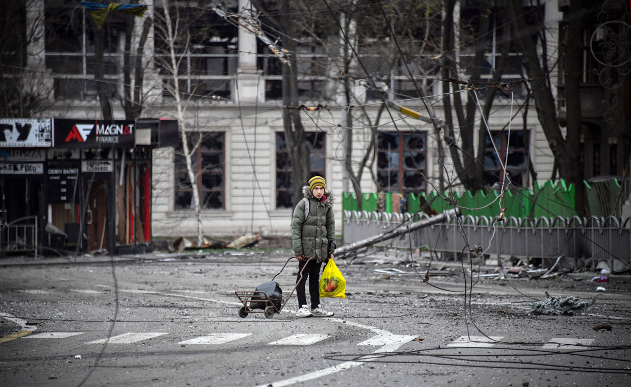 A young man walks on a street of Mariupol, on April 12.