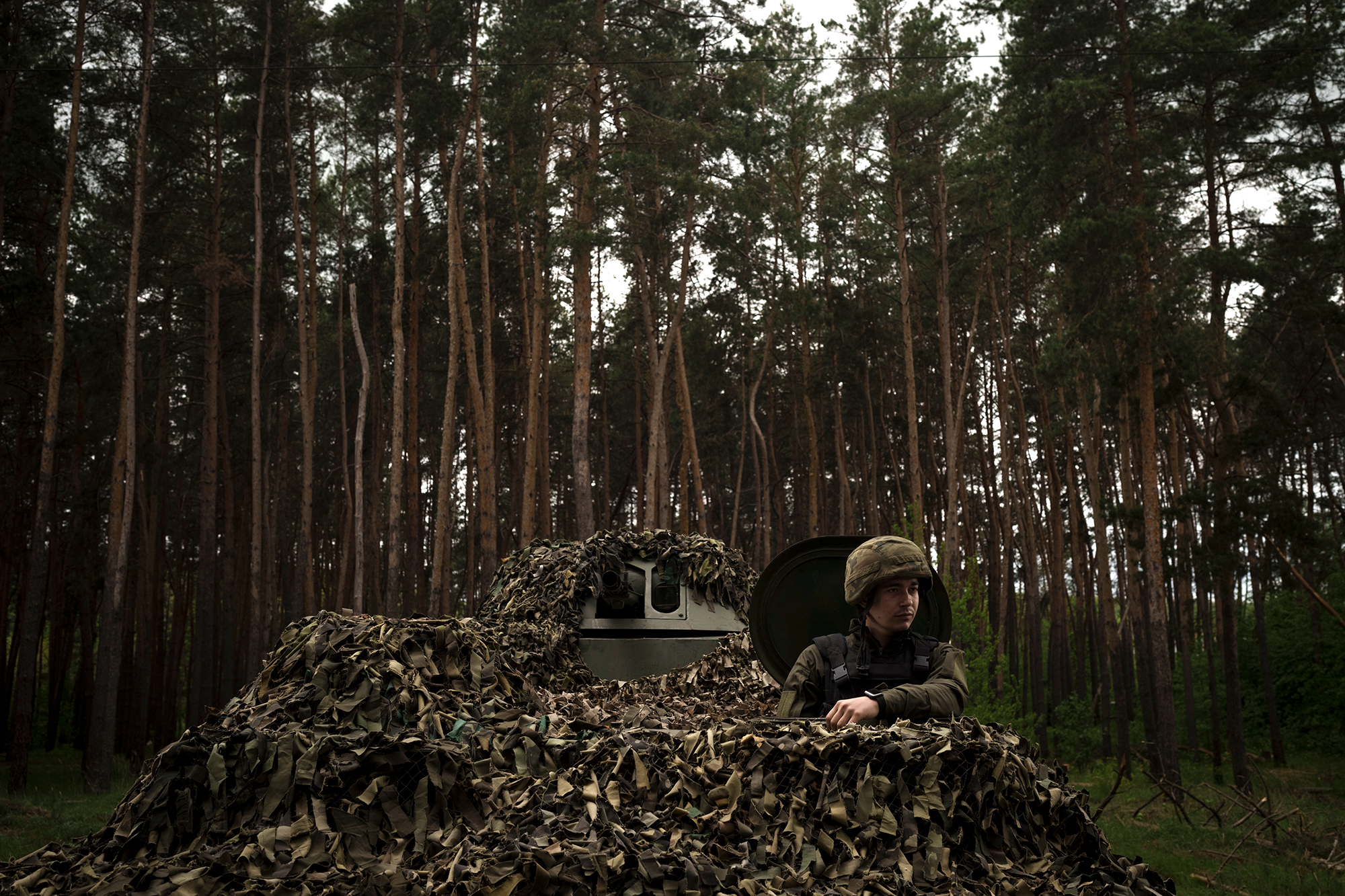 A Ukrainian soldier sits inside a tank at a position near Kharkiv, Ukraine, on Monday, May 9. 
