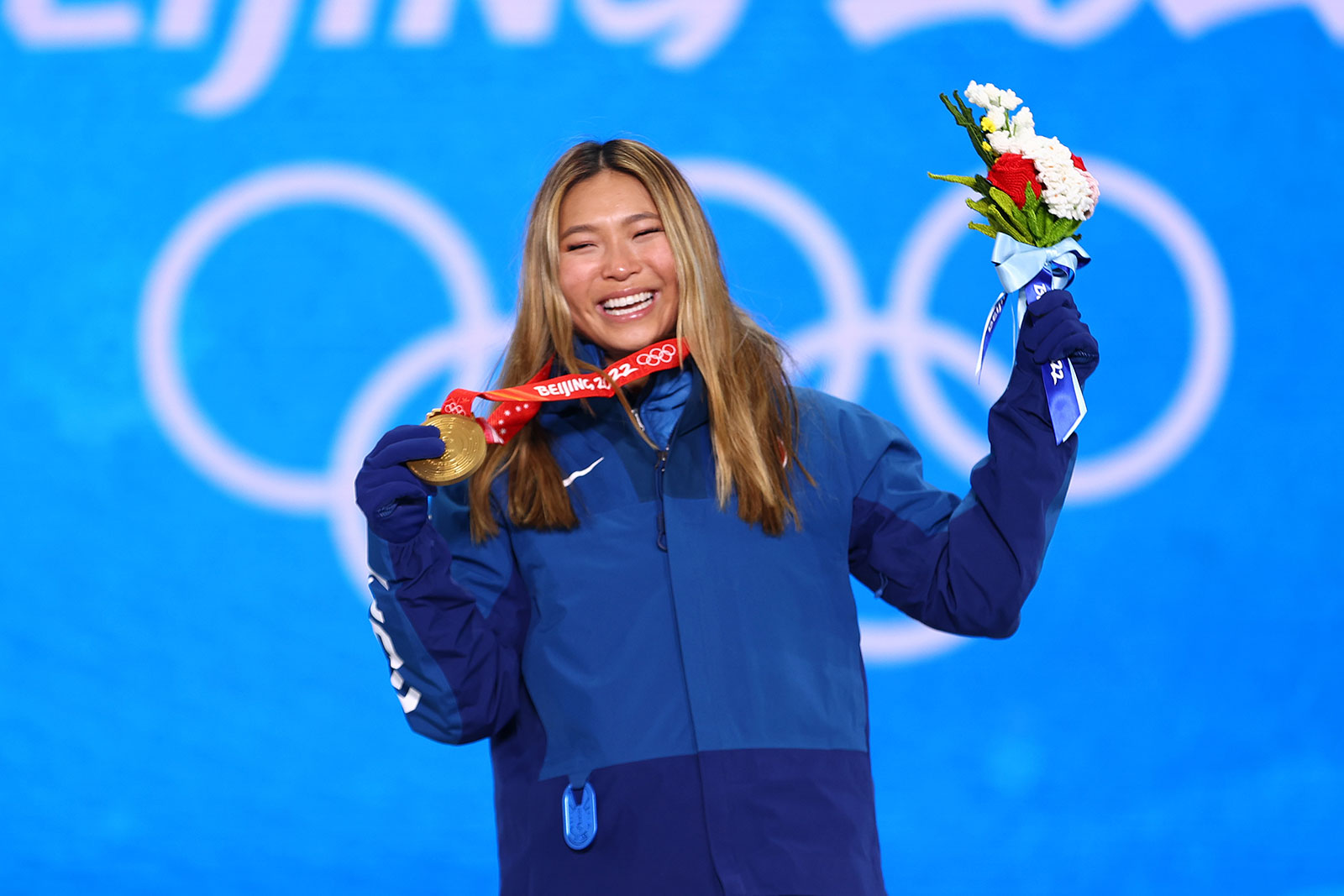 American snowboarder Chloe Kim shows off her gold medal during the medal ceremony for the women's halfpipe on Thursday.