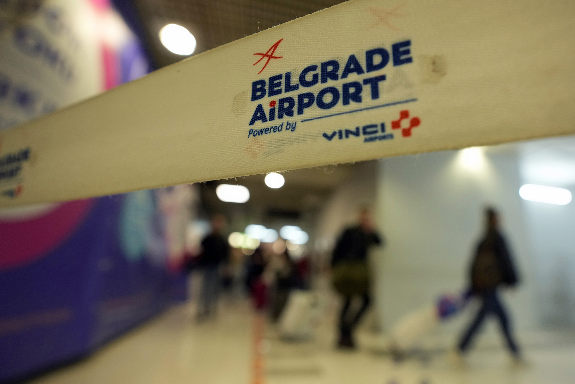 Passengers from the Moscow-Belgrade flight, operated by Air Serbia, pass through the airport building in Belgrade, Serbia on Wednesday, Sept. 21.