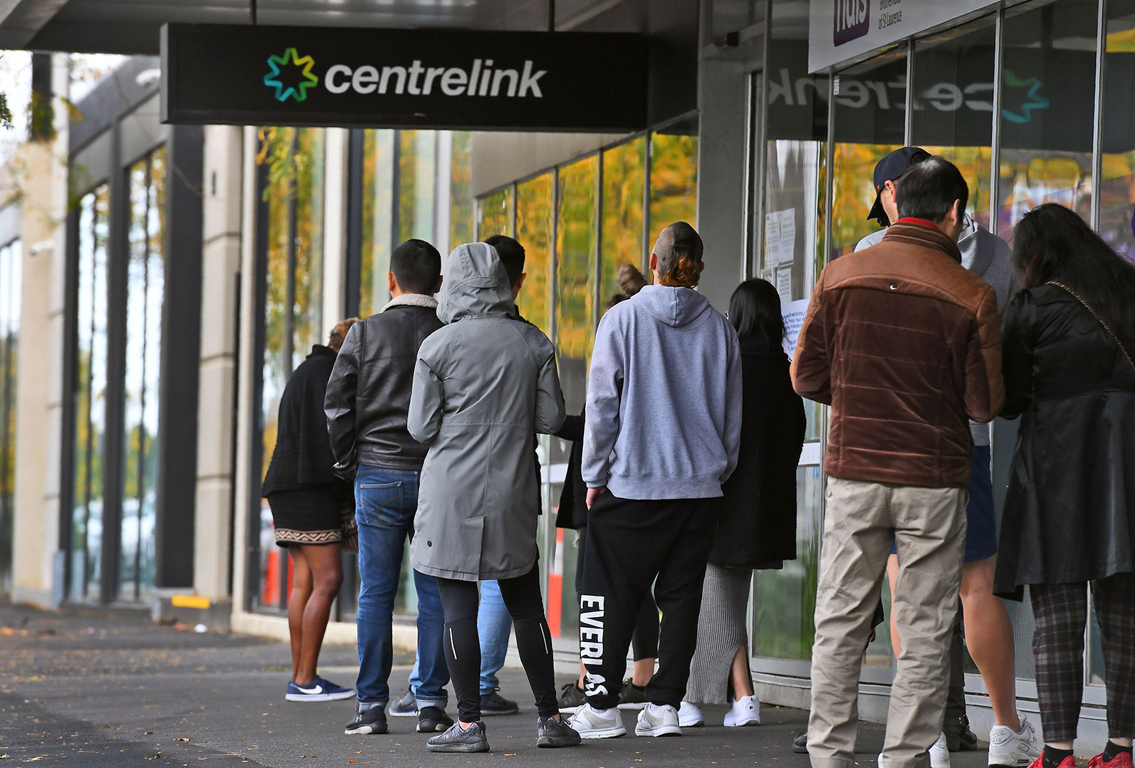 People line up outside a social security office in Melbourne, Australia on April 20.