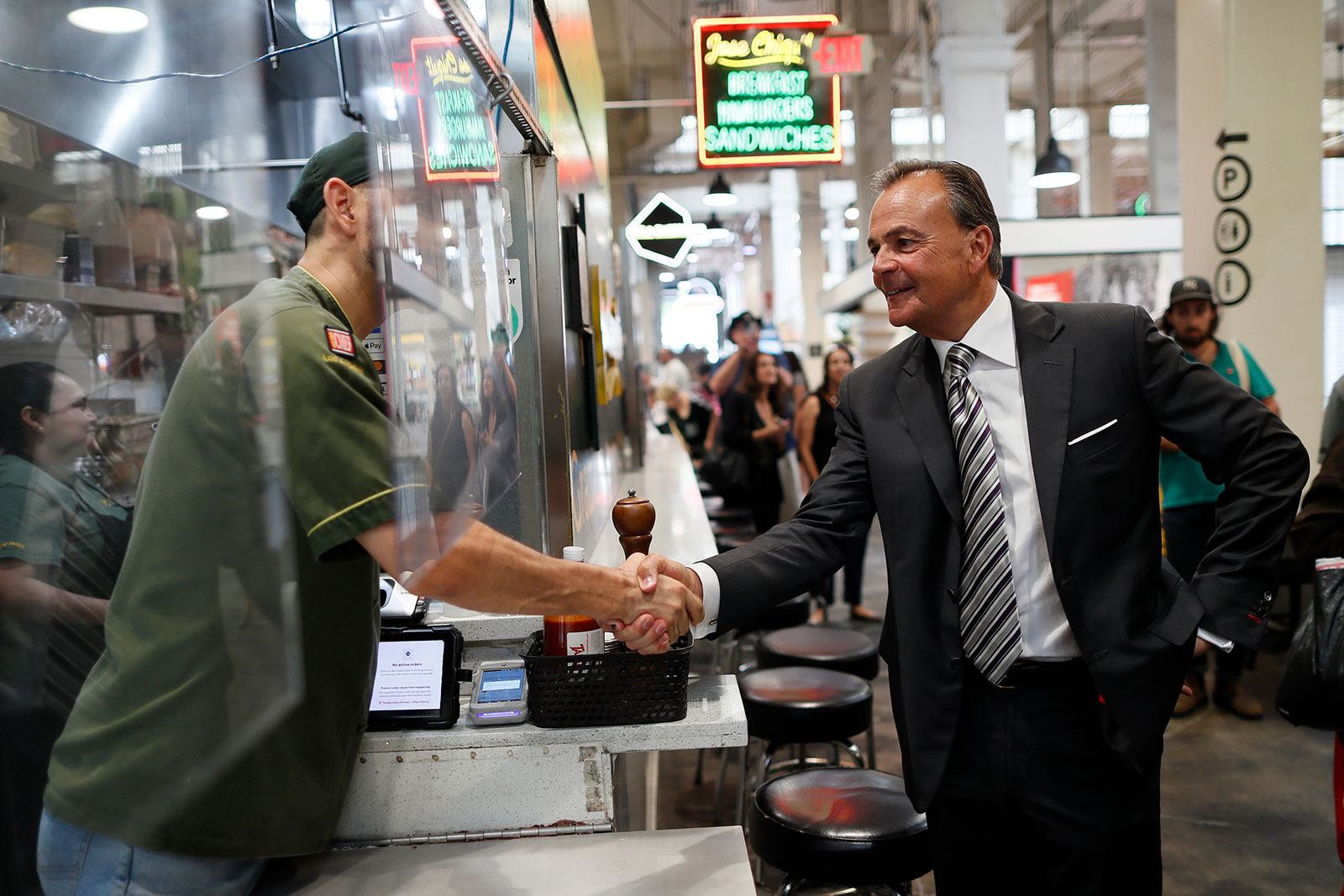 Rick Caruso tours Grand Central Market as he continues his campaign to become mayor of Los Angeles on June 2.