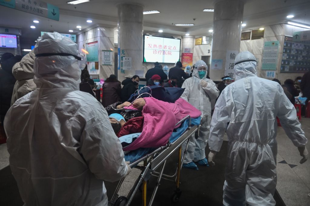 Medical staff arrive with a patient at the Wuhan Red Cross Hospital last month.