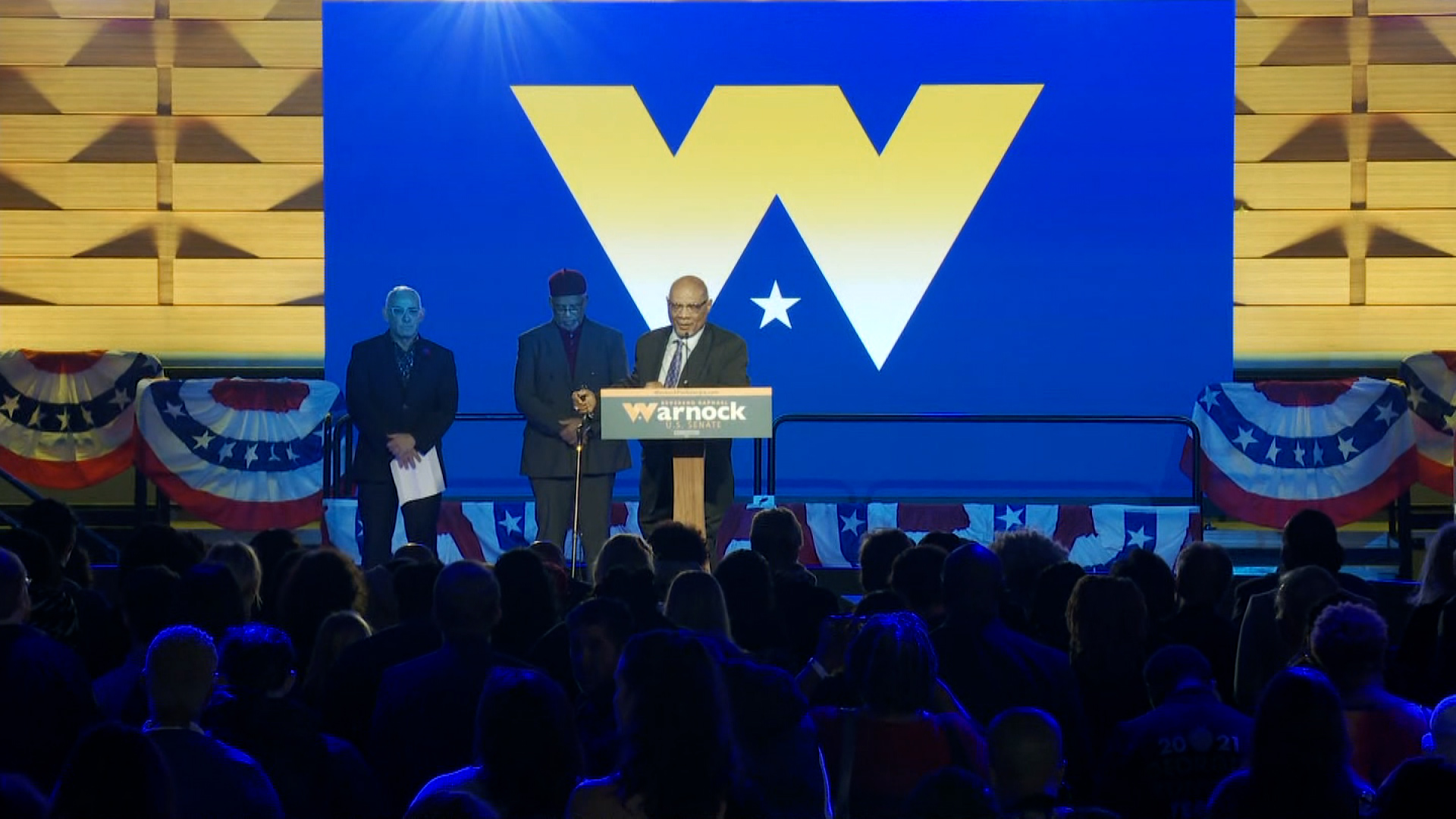 Faith leaders kick off the election night party of US Sen. Raphael Warnock on Tuesday.