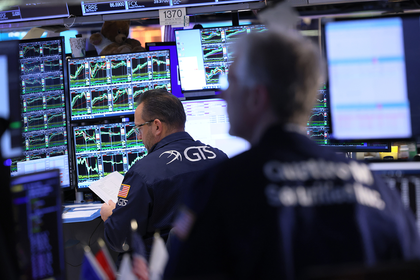 Traders work on the floor of the New York Stock Exchange during morning trading on January 31.