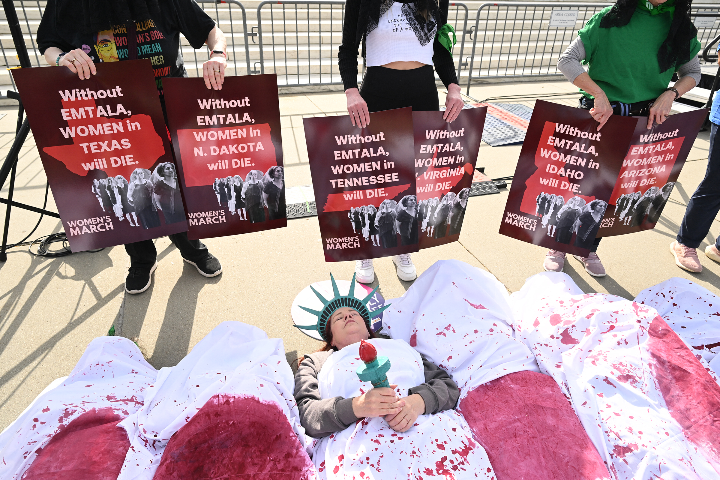 People participate in a "Die-In" to support "reproductive rights and emergency abortion care" outside the US Supreme Court.