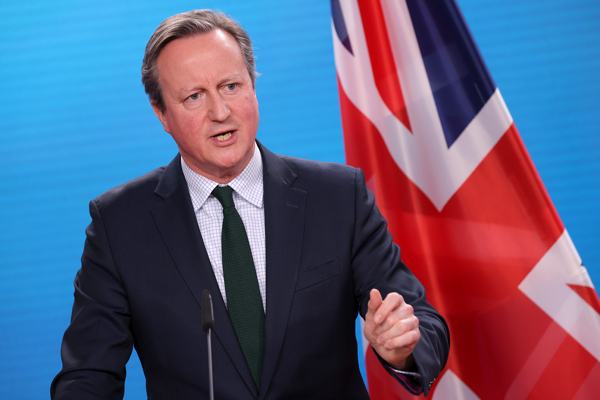 British Foreign Secretary David Cameron speaks to the media in Berlin, Germany, on March 7.