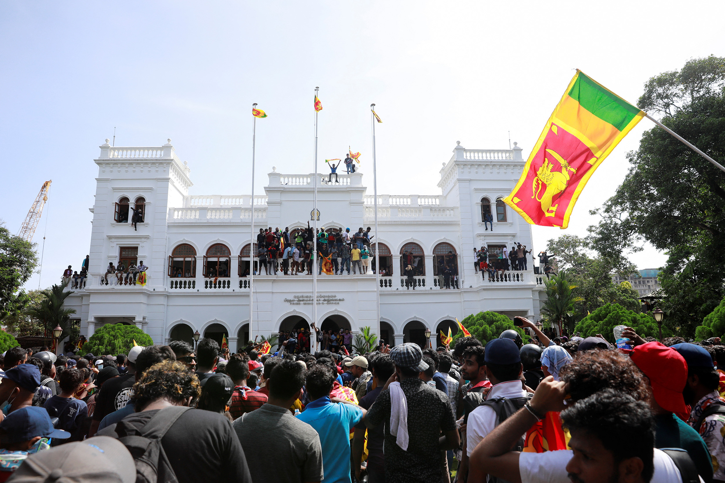 Demonstrators celebrate after entering the building of the office of Sri Lanka's Prime Minister Ranil Wickremesinghe in Colombo, Sri Lanka, on July 13.