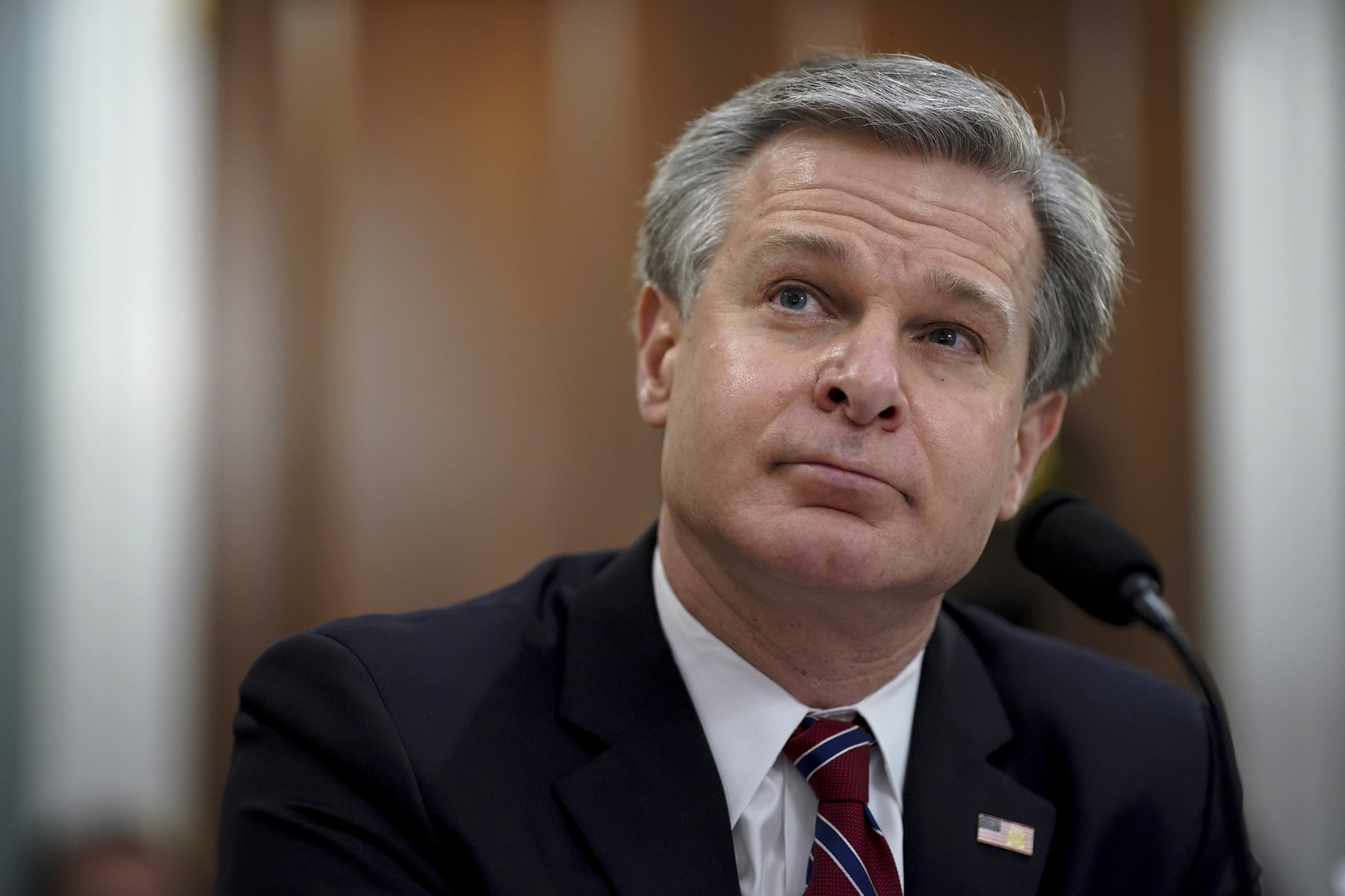 Christopher Wray, director of the Federal Bureau of Investigation, listens during a House Intelligence Committee hearing on April 15 in Washington, D.C. 
