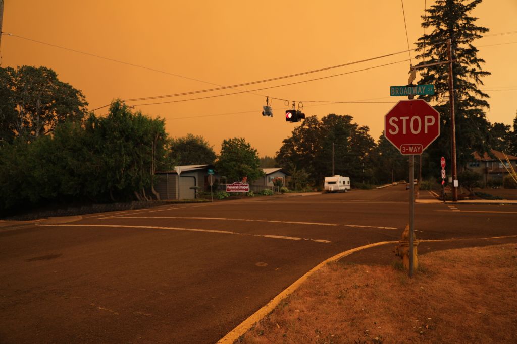 An orange smoke-filled sky is seen above Estacada, Oregon, Wednesday, as fires burn nearby.