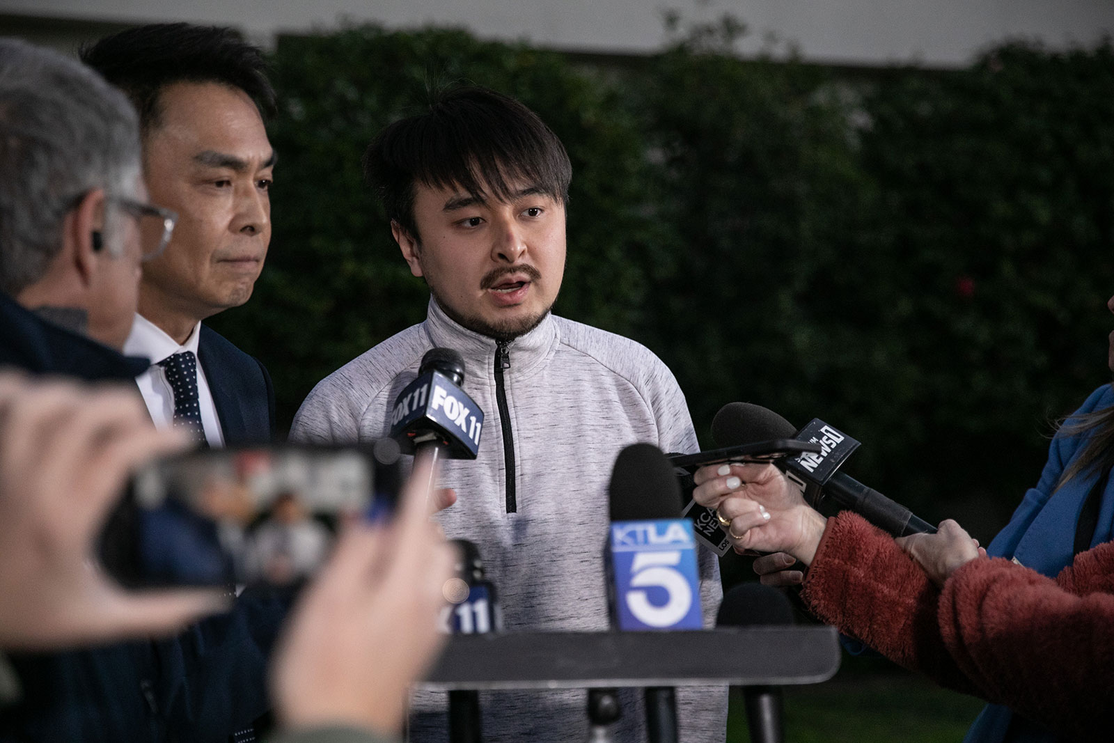 Brandon Tsay, who encountered an armed man in the lobby of Lai Lai Ballroom & Studio in Alhambra, California, speaks to the media Monday. After opening fire inside the Star Ballroom Dance Studio in Monterey Park, the gunman went to a second dance hall in Alhambra, officials said.