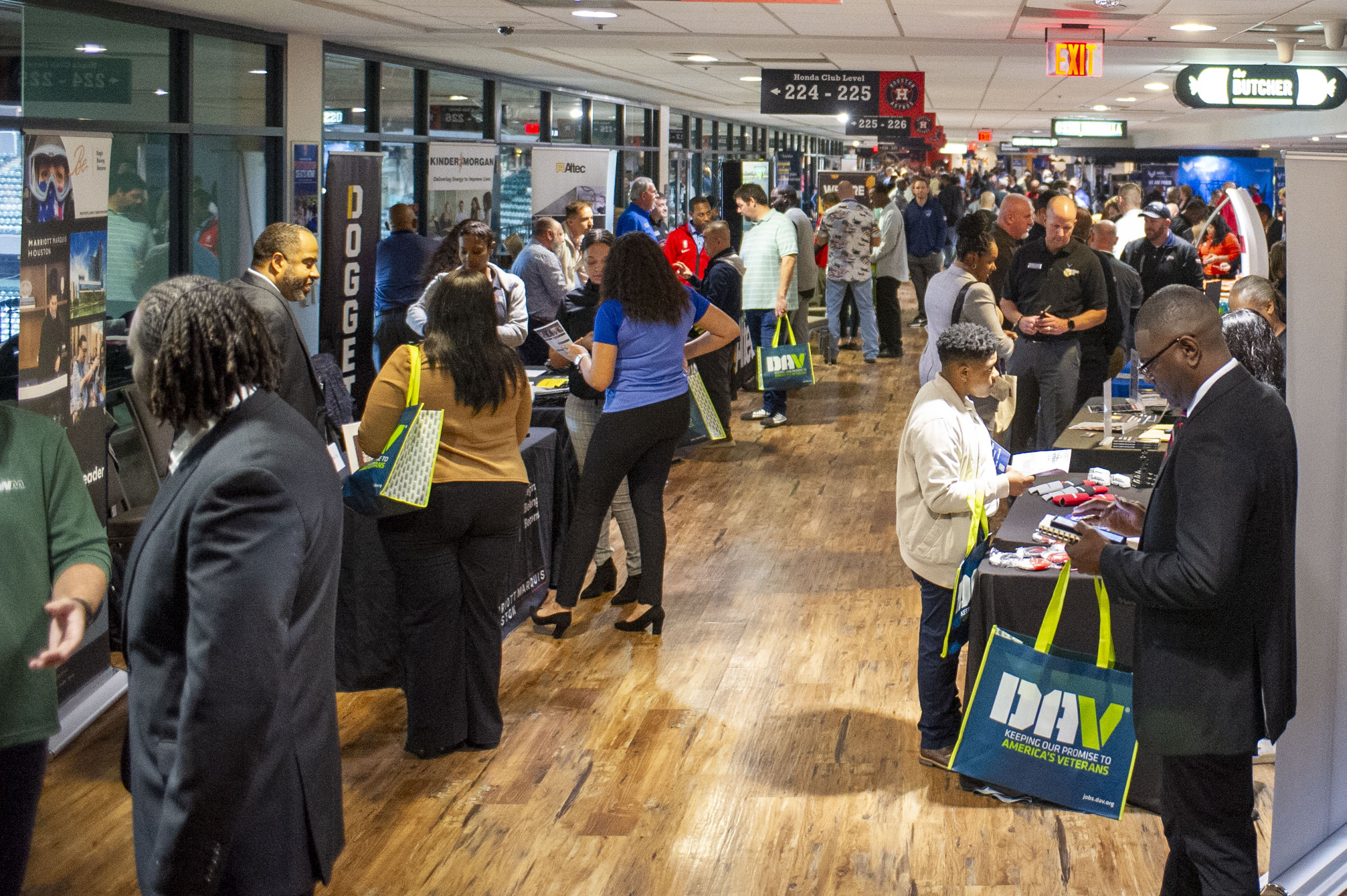 Veterans meet with representatives from area employers during the Houston Veterans Job Fair, on November 30, at Minute Maid Park in Houston, Texas.