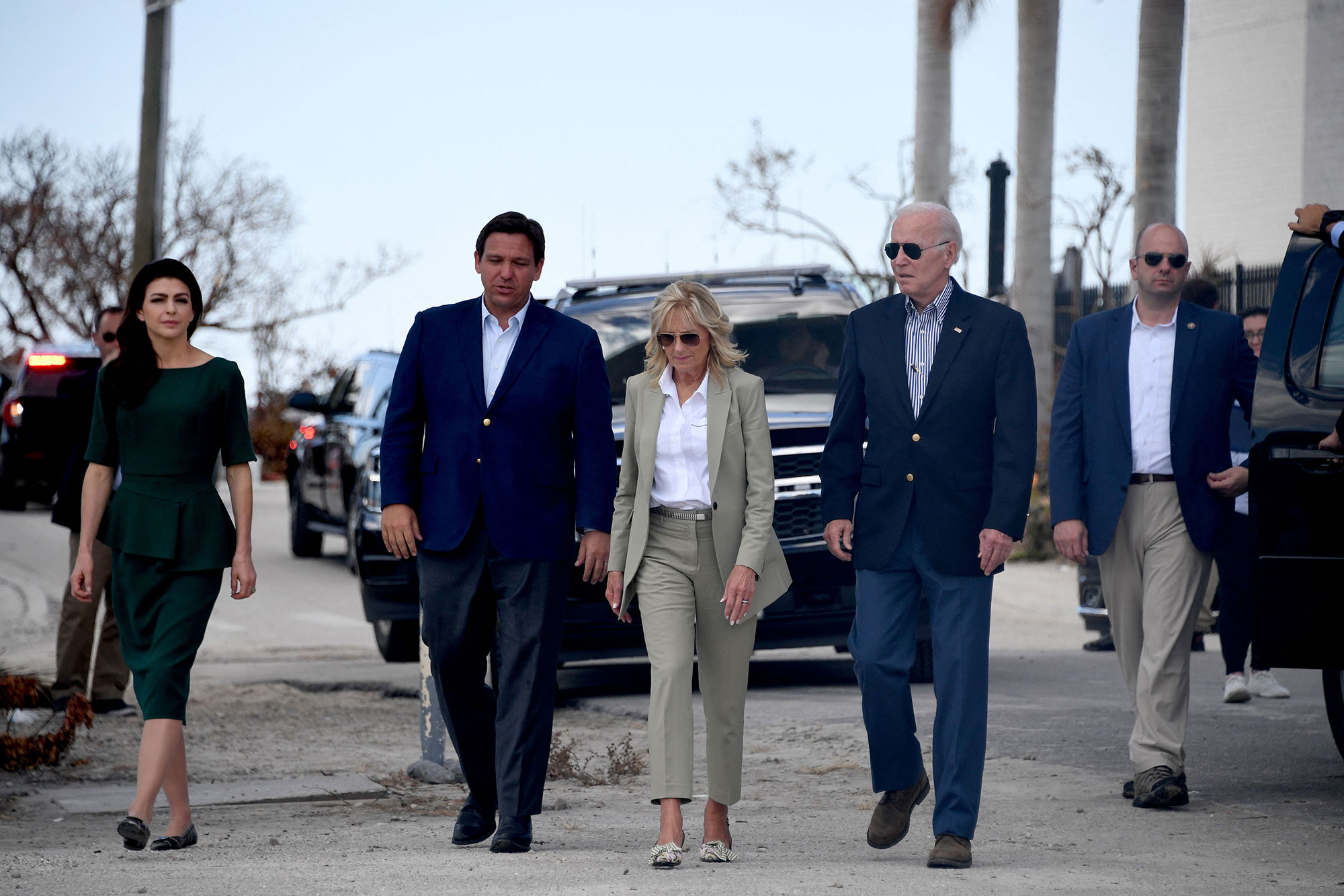 Casey DeSantis, Florida Gov. Ron DeSantis, First Lady Jill Biden, and President Joe Biden walk to meet with residents impacted by Hurricane Ian in Fort Myers, Florida, on October 5. 