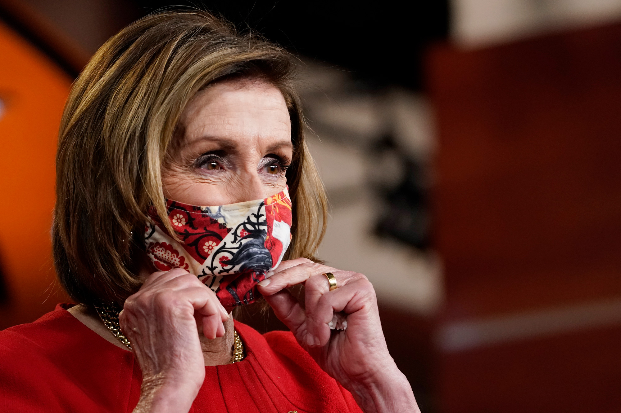 House Speaker Nancy Pelosi puts her mask back on after a news conference on Capitol Hill in Washington, DC, on May 13.