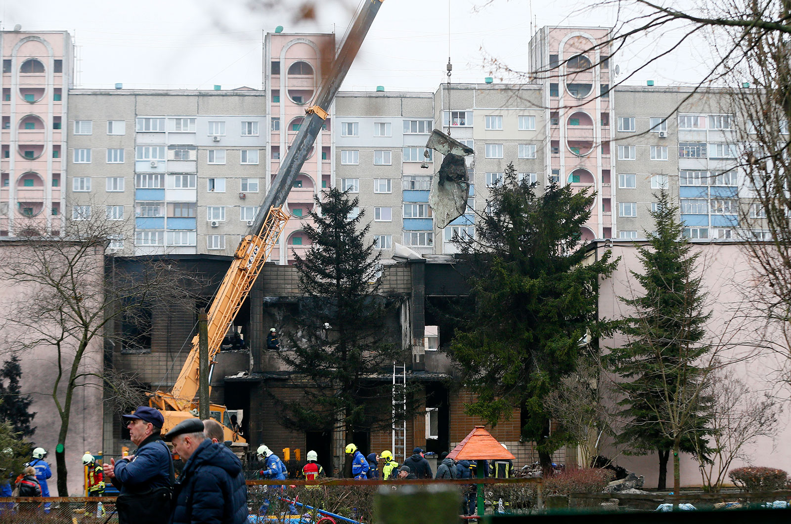 Rescuers work the scene of a helicopter crash in Brovary, Ukraine, on January 18. 