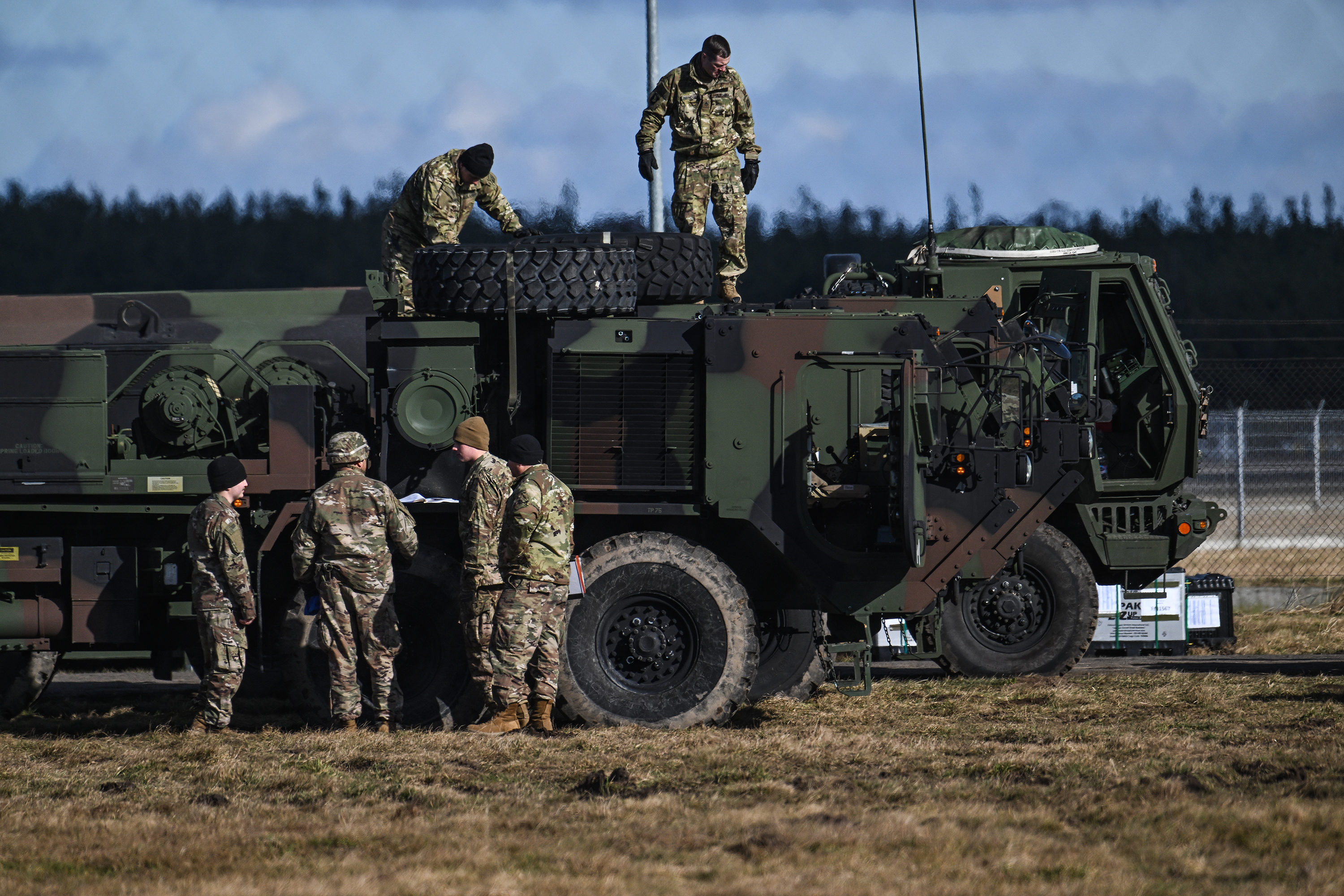 US soldiers handle military equipment at a temporary base in Mielec, Poland, on February 12. 