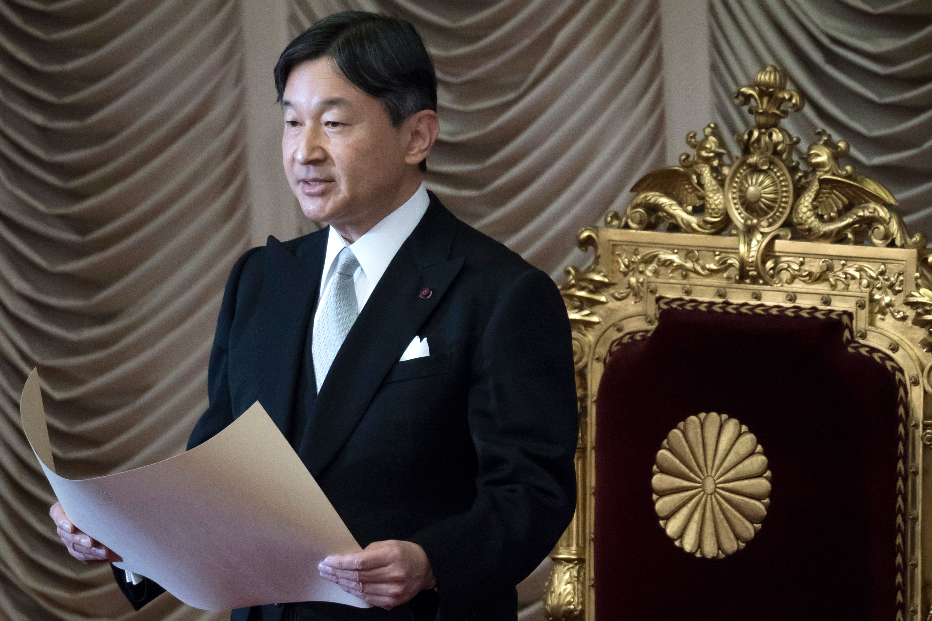 In this file photo, Japan's Emperor Naruhito gives an address at the opening of the 201st ordinary session of the Diet at the upper house of the parliament on January 20 in Tokyo.