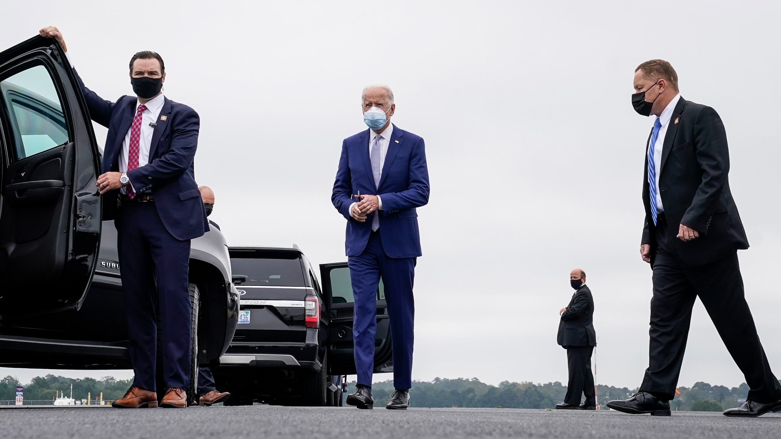 Democratic presidential nominee Joe Biden walks to his motorcade as he arrives at Columbus Airport on October 27 in Columbus, Georgia. 
