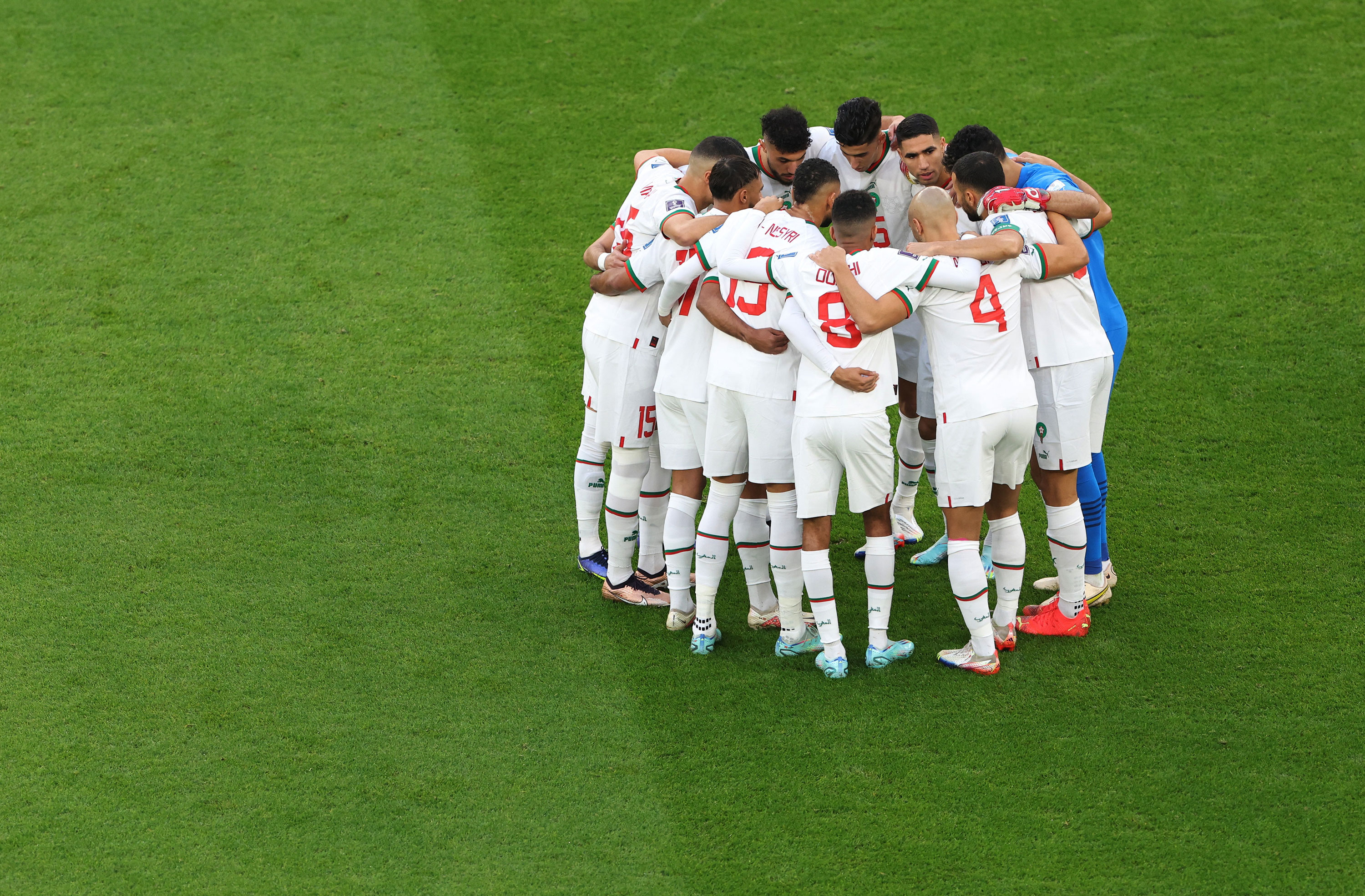Morocco players huddle before the match versus Belgium on Sunday. 