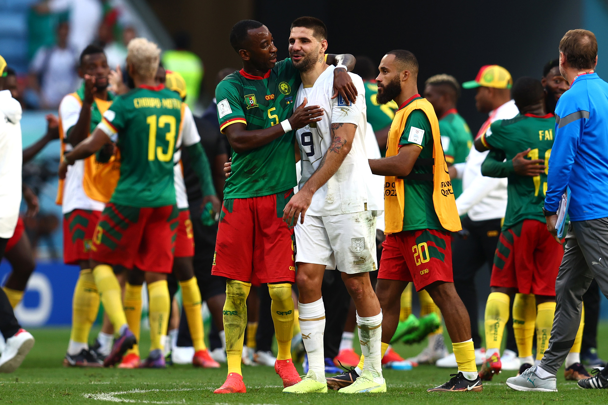 Serbia's Aleksandar Mitrovic hugging Cameroon's Gael Ondoua at the end of a World Cup classic.