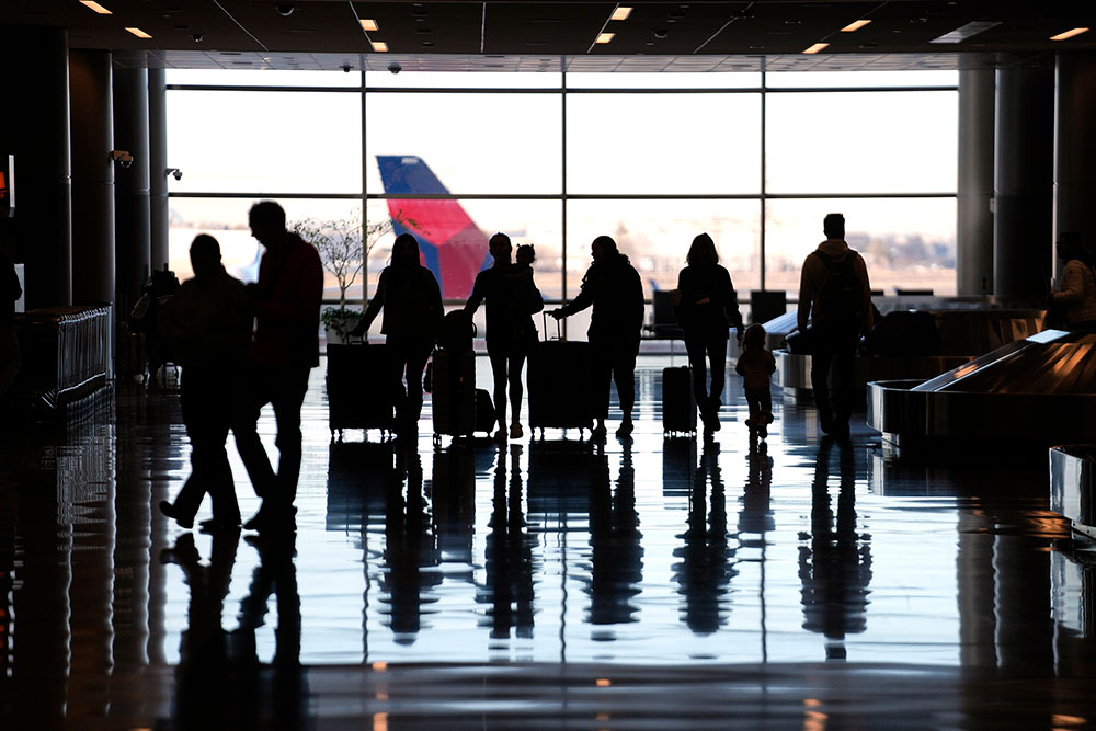 People pass through Salt Lake City International Airport Wednesday, January 11, 2022.