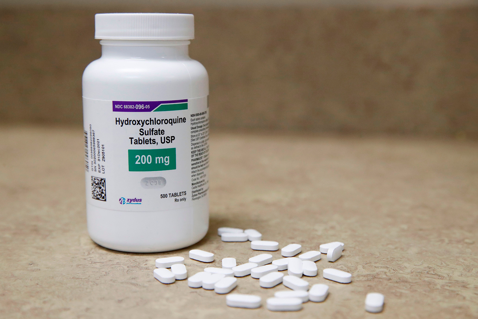 A bottle and pills of Hydroxychloroquine sit on a counter at Rock Canyon Pharmacy in Provo, Utah, on Wednesday, May 20.