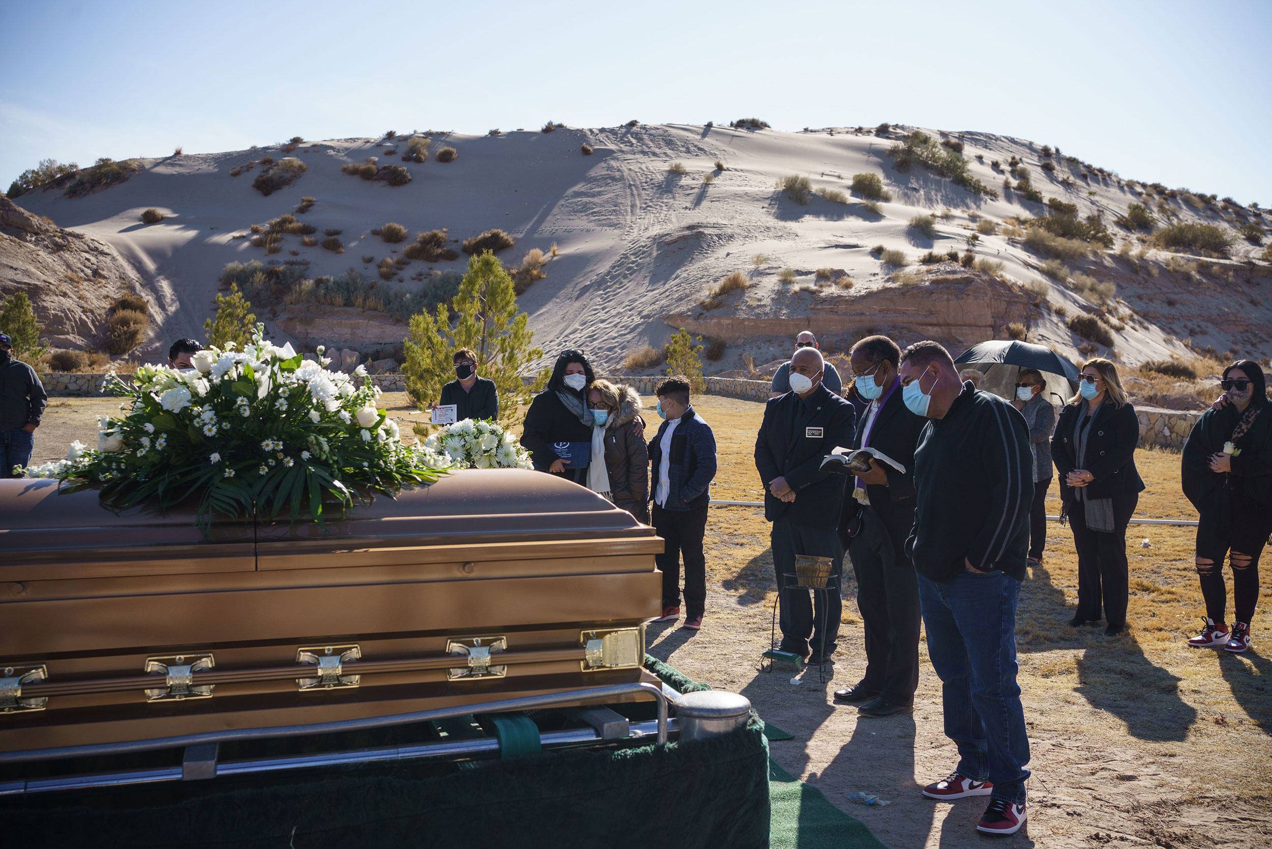 Family and friends attend the funeral of Humberto Rosales on December 3, in Santa Teresa, New Mexico. Rosales died from Covid-19 complications.
