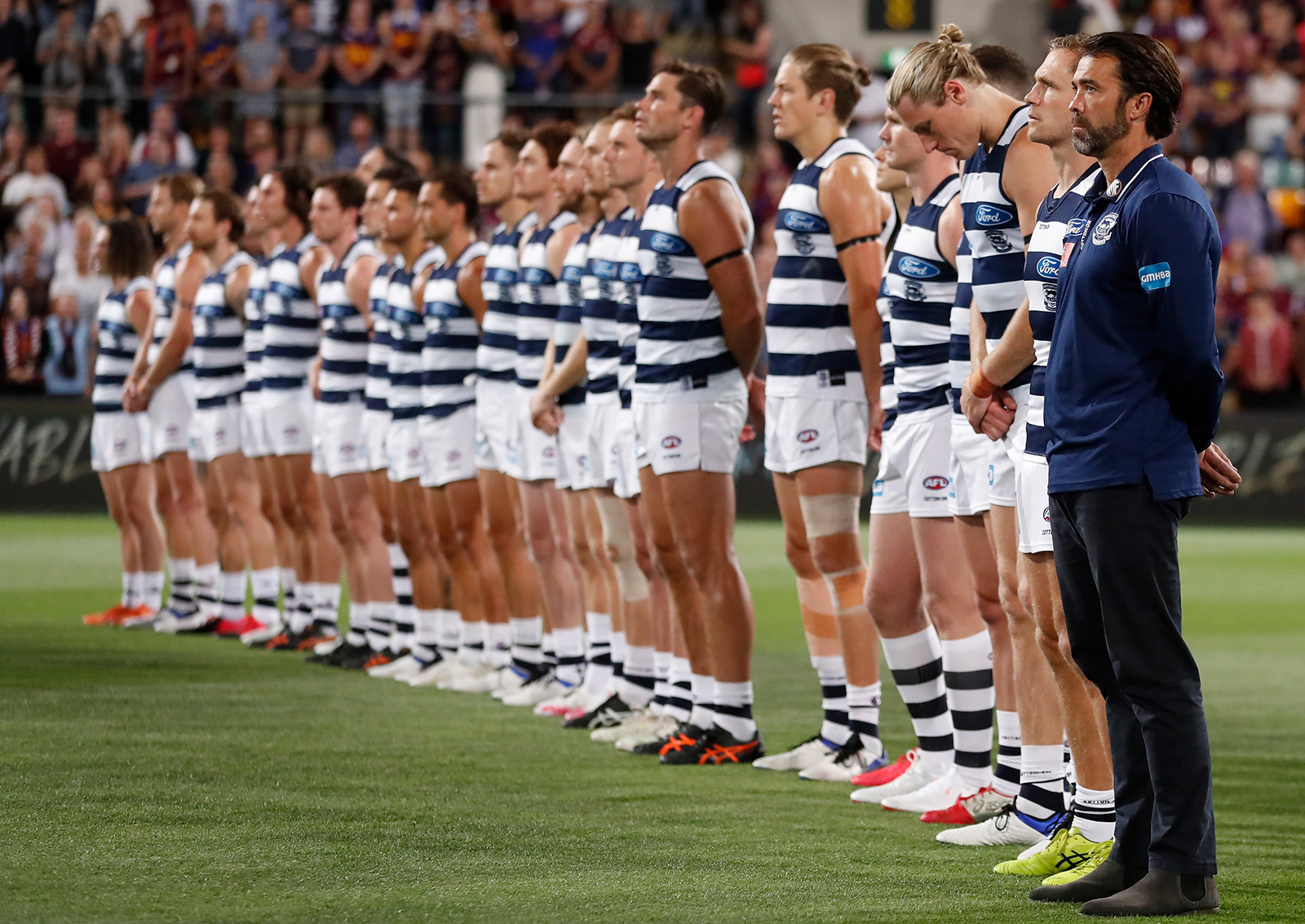 The Geelong Cats line up for the national anthem during the 2020 AFL Second Preliminary Final match with  the Brisbane Lions at The Gabba in Brisbane, Australia, on October 17.