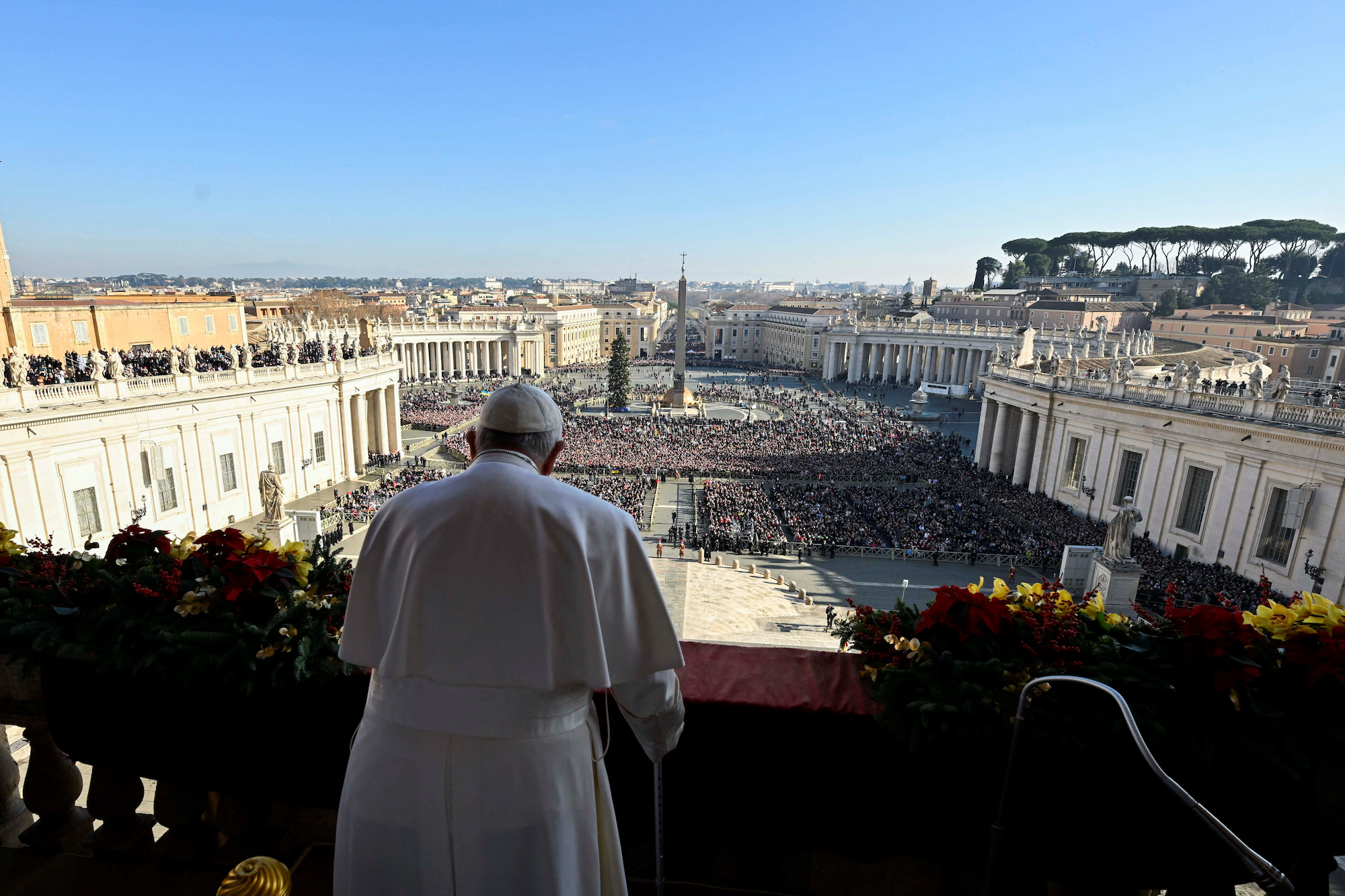 Pope Francis delivers his annual Christmas Day message from the main balcony of St. Peter's Basilica at the Vatican on December 25.