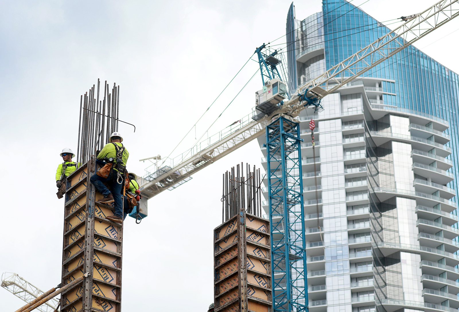 Construction workers build a residential high rise on October 2, 2023 in Miami, Florida. 