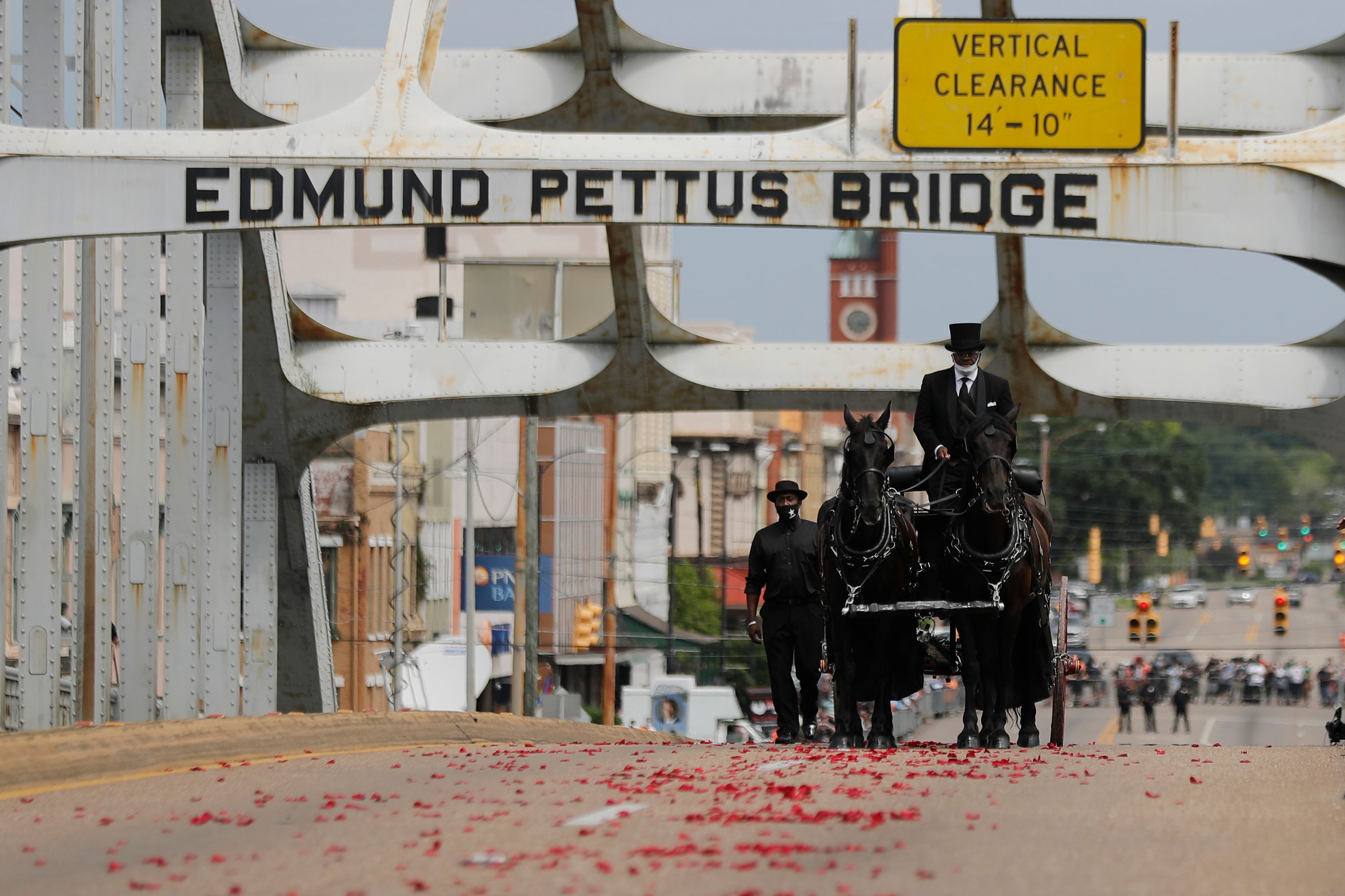 The casket of Rep. John Lewis is carried by horse-drawn carriage over the Edmund Pettus Bridge in Selma, Alabama, on July 26.